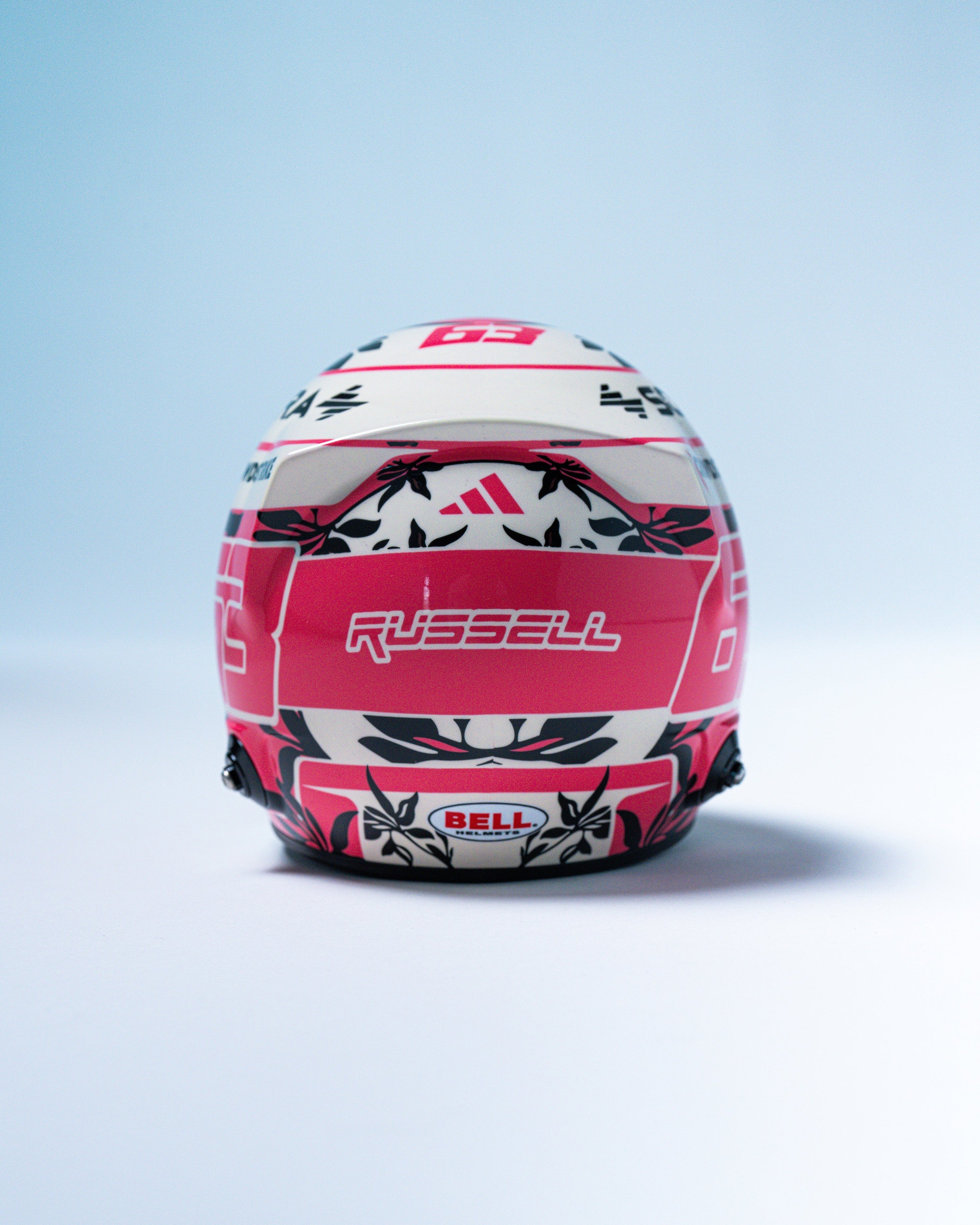 George Russell 2025 Miami Mini Bell Helmet Replica 1:2 — close-up design detail showing Mercedes-AMG PETRONAS F1 styling and product details | Dash Racegear