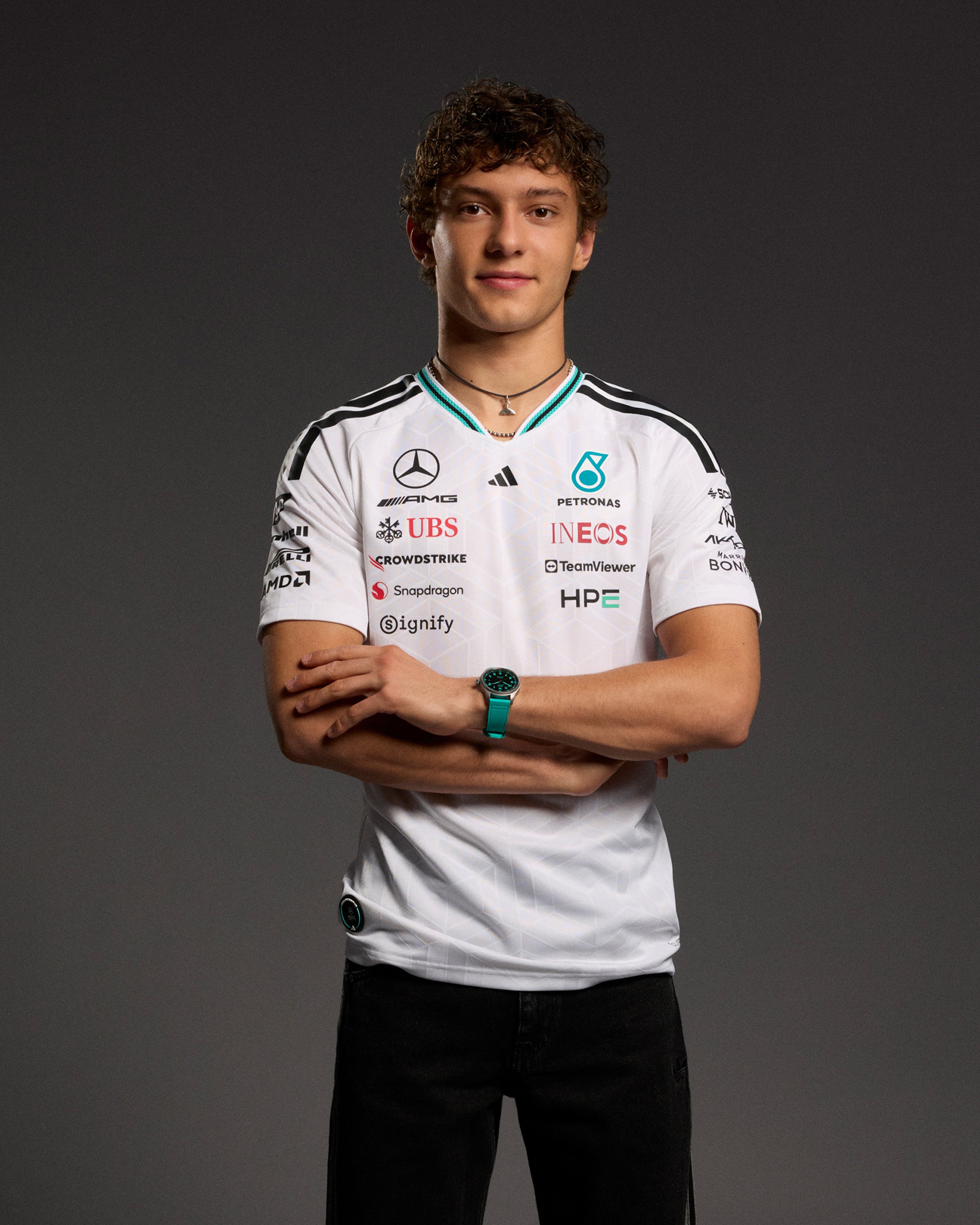 Mens 2026 Authentic Driver Tee White — close-up design detail showing Mercedes-AMG PETRONAS F1 styling and product details | Dash Racegear