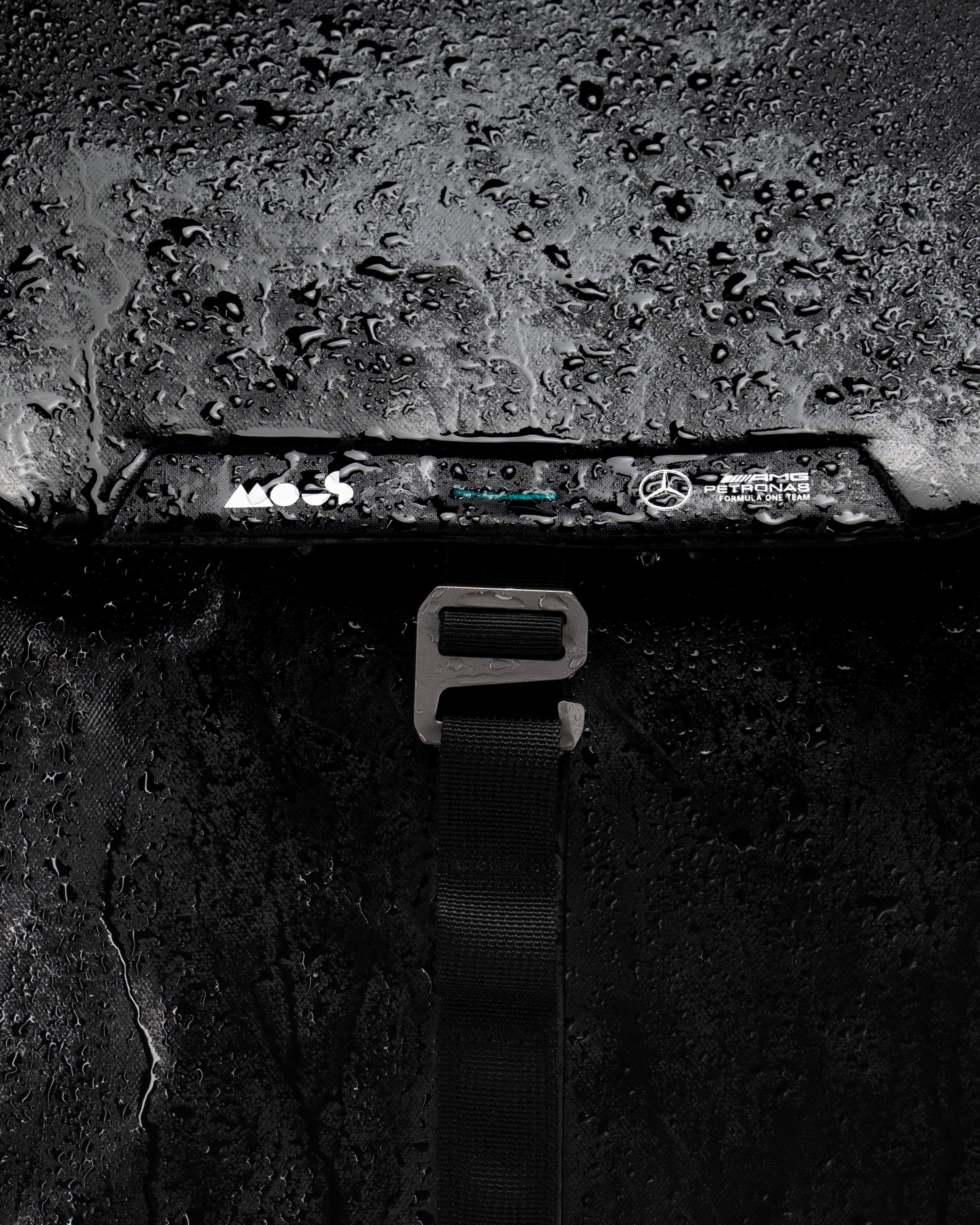 Mous x Mercedes-AMG F1 Team Day Backpack — close-up design detail showing Mercedes-AMG PETRONAS F1 styling and product details | Dash Racegear