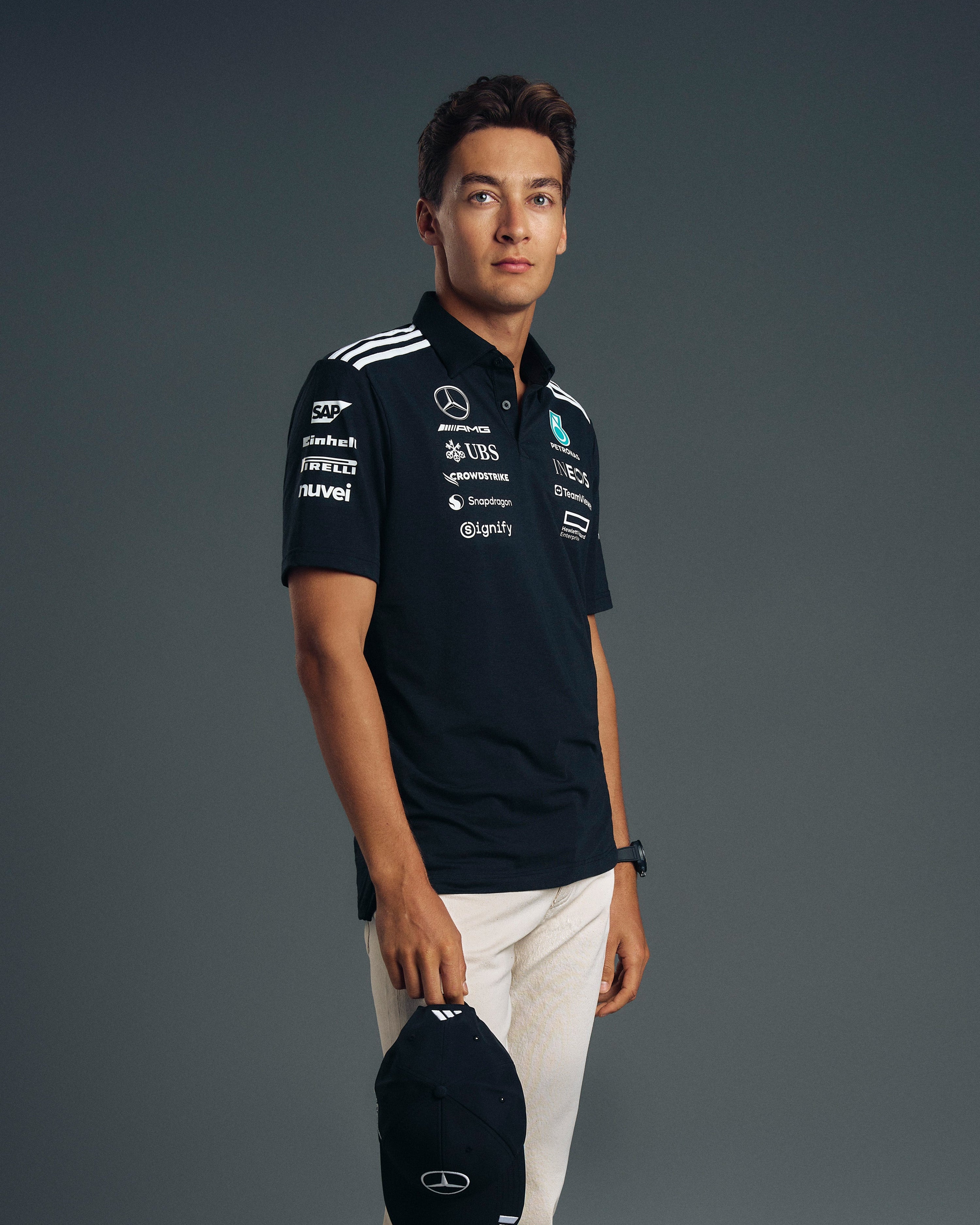 Mens 2025 Team Polo Black — primary product view showing Mercedes-AMG PETRONAS F1 styling and product details | Dash Racegear