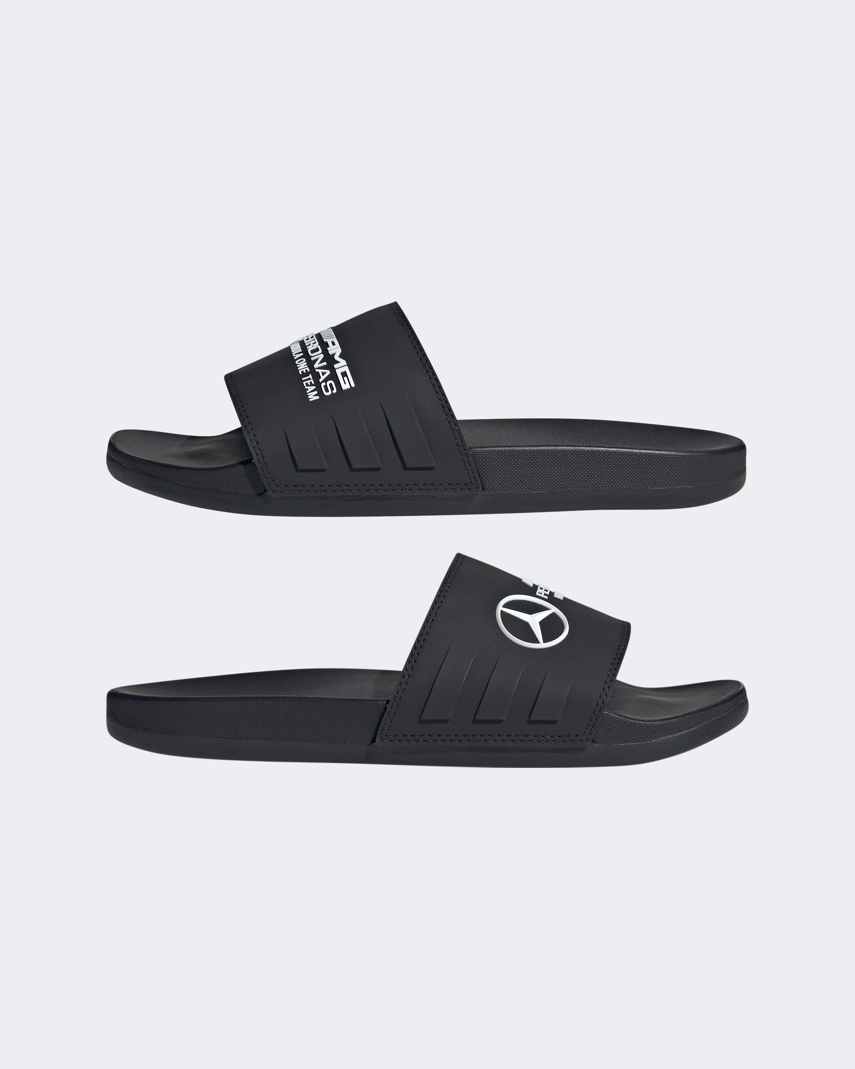 Adilette Comfort Slides Black — close-up design detail showing Mercedes-AMG PETRONAS F1 styling and product details | Dash Racegear
