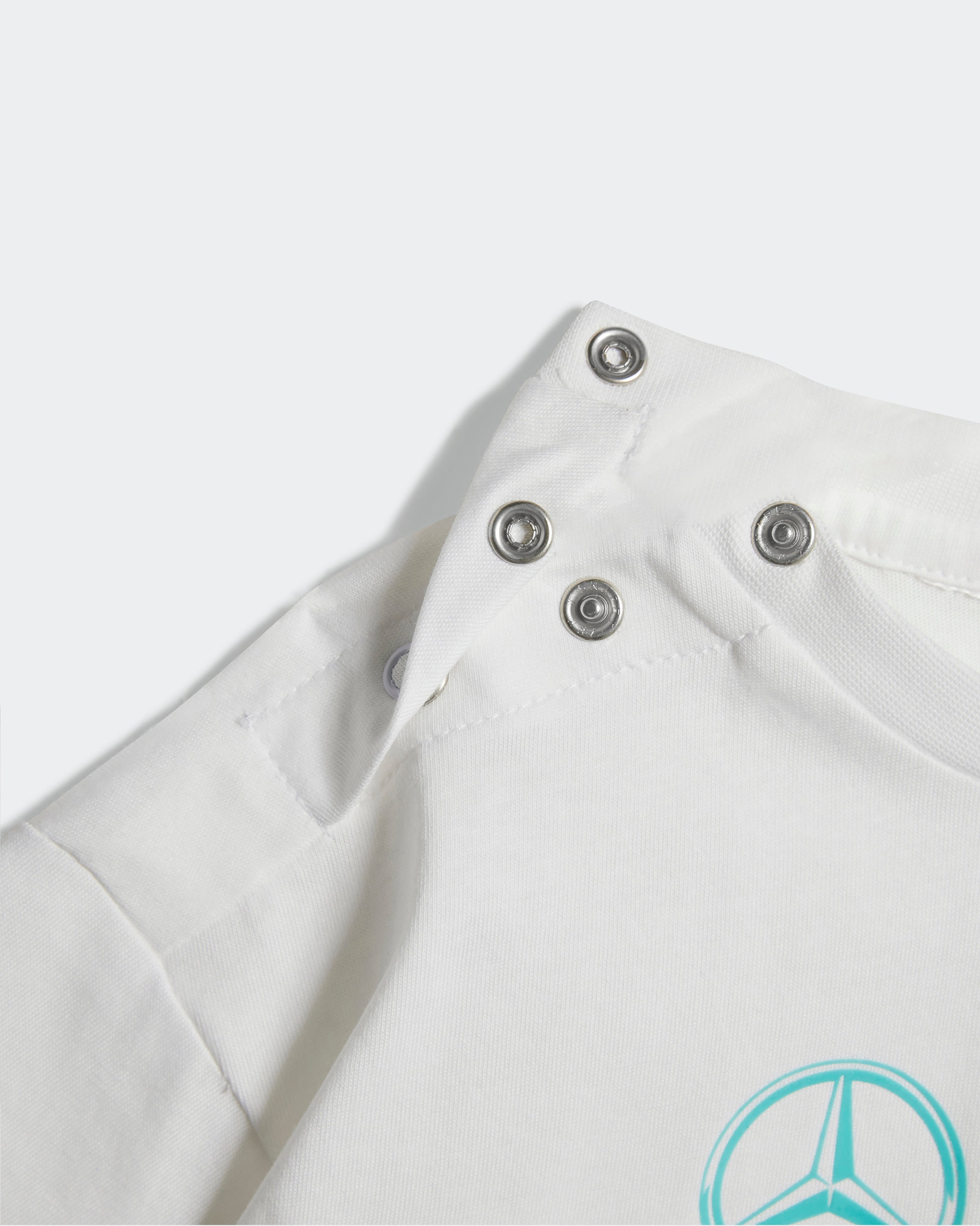 Kids DNA Short Sleeve Jogger White — close-up design detail showing Mercedes-AMG PETRONAS F1 styling and product details | Dash Racegear