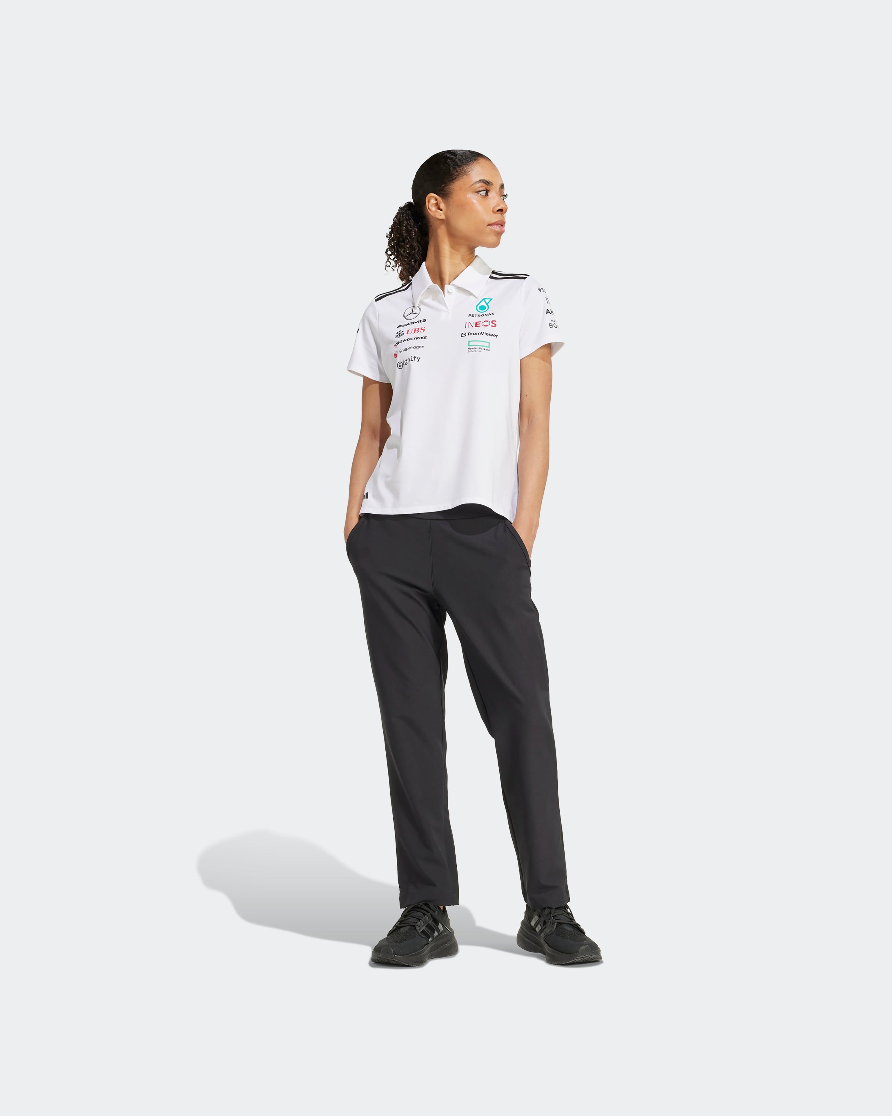 Womens 2025 Team Polo White — close-up design detail showing Mercedes-AMG PETRONAS F1 styling and product details | Dash Racegear