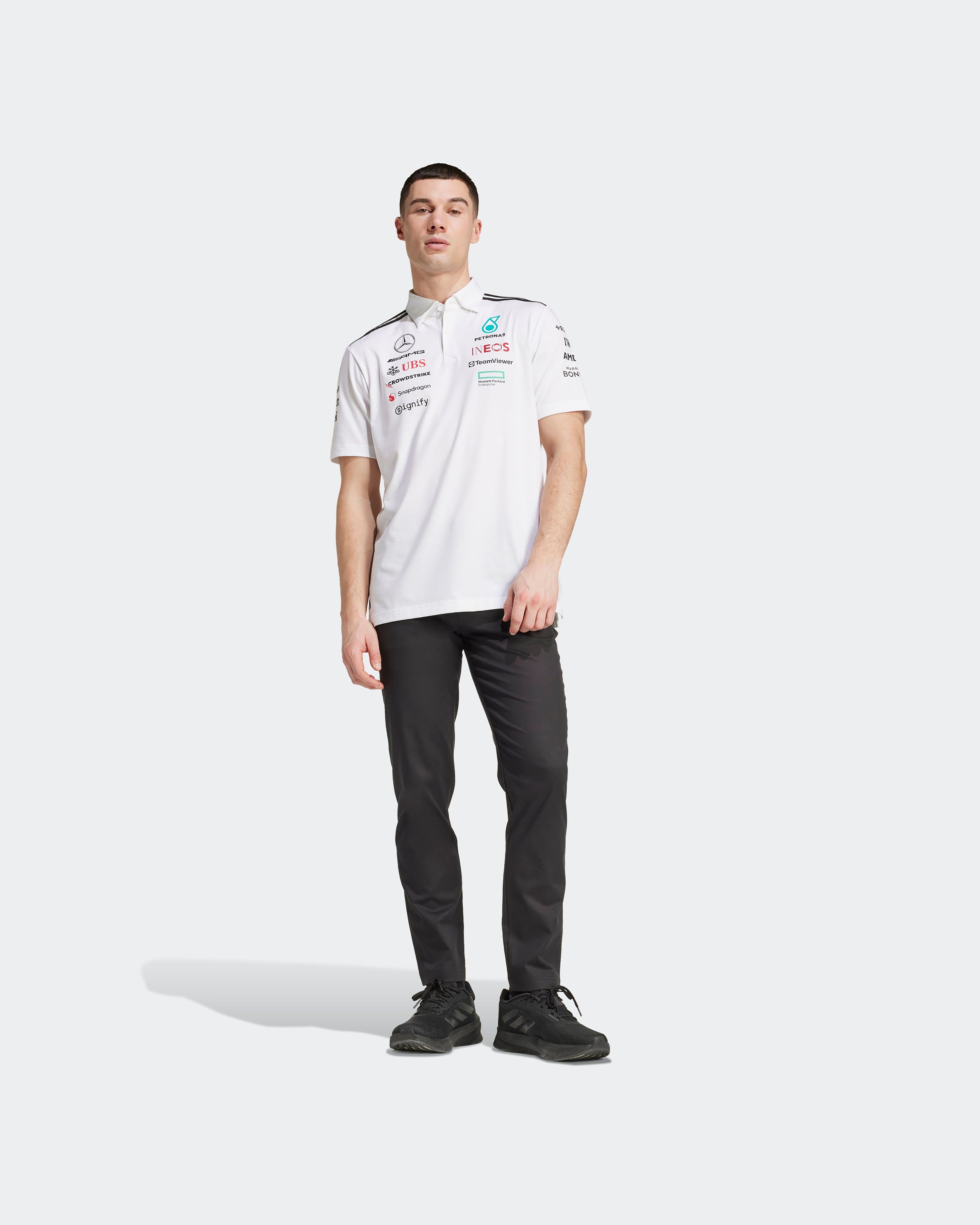 Mens 2025 Team Polo White — close-up design detail showing Mercedes-AMG PETRONAS F1 styling and product details | Dash Racegear