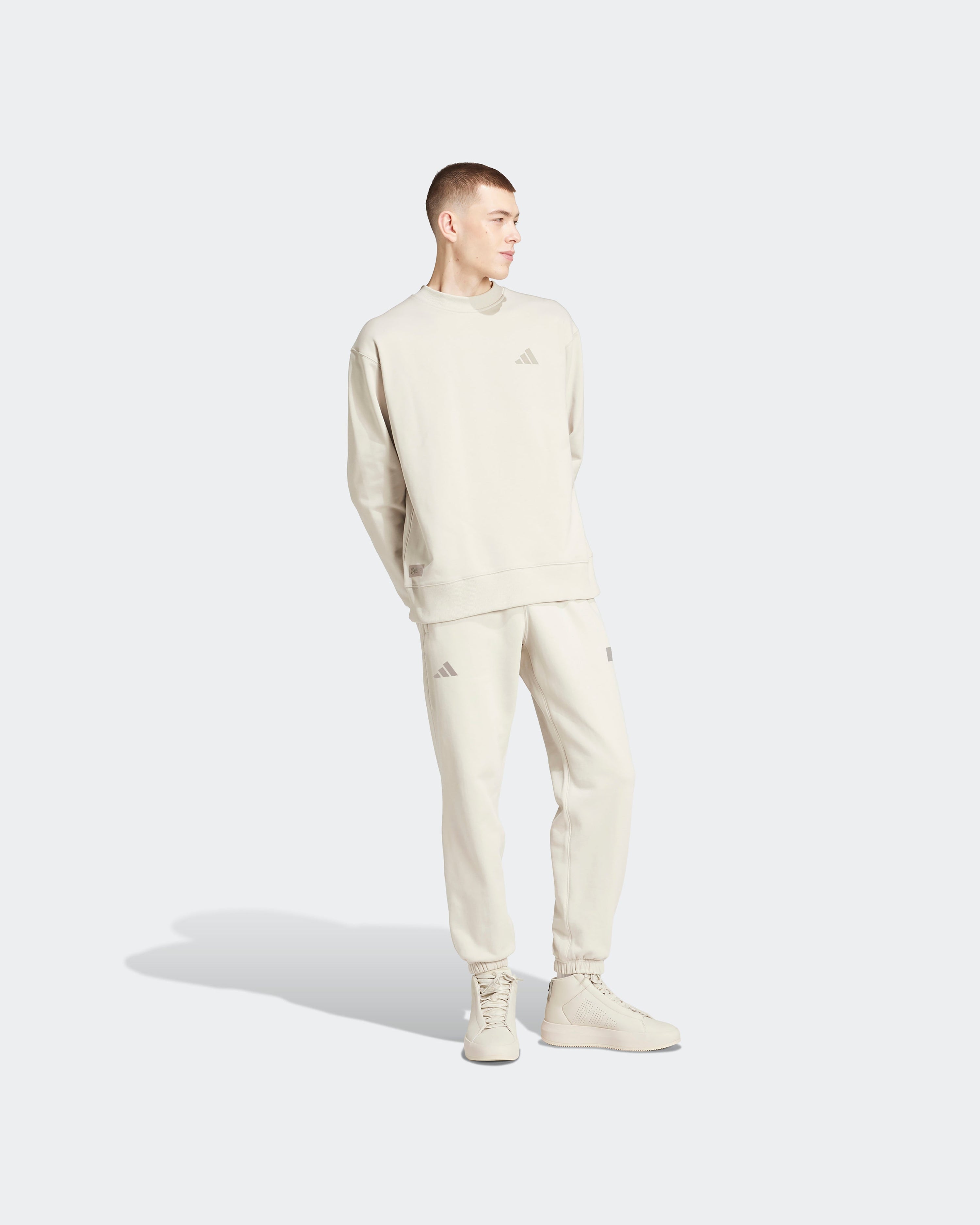 Mens Premium Sweat Joggers Beige — close-up design detail showing Mercedes-AMG PETRONAS F1 styling and product details | Dash Racegear