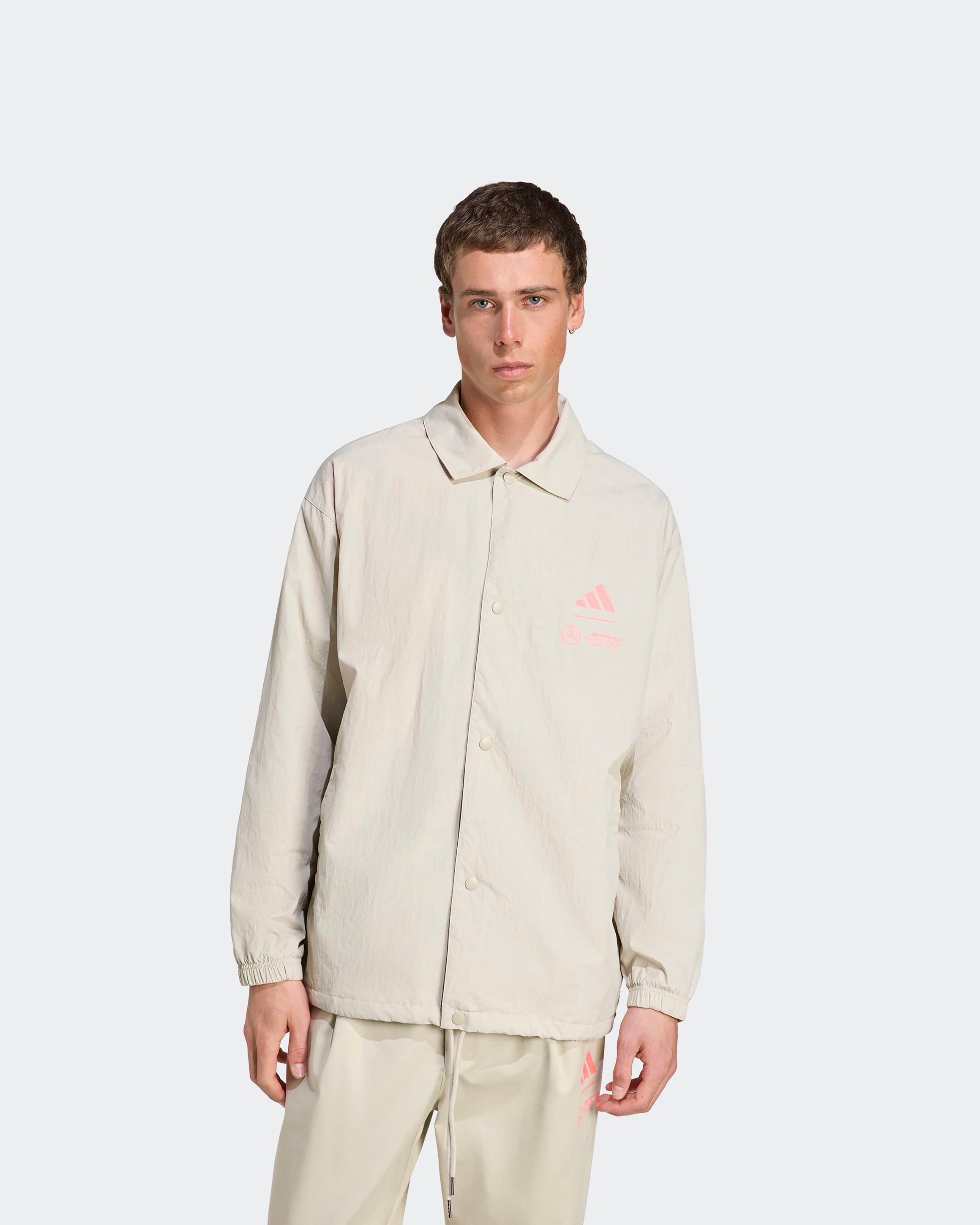 Mens Miami Coach Jacket Beige — primary product view showing Mercedes-AMG PETRONAS F1 styling and product details | Dash Racegear