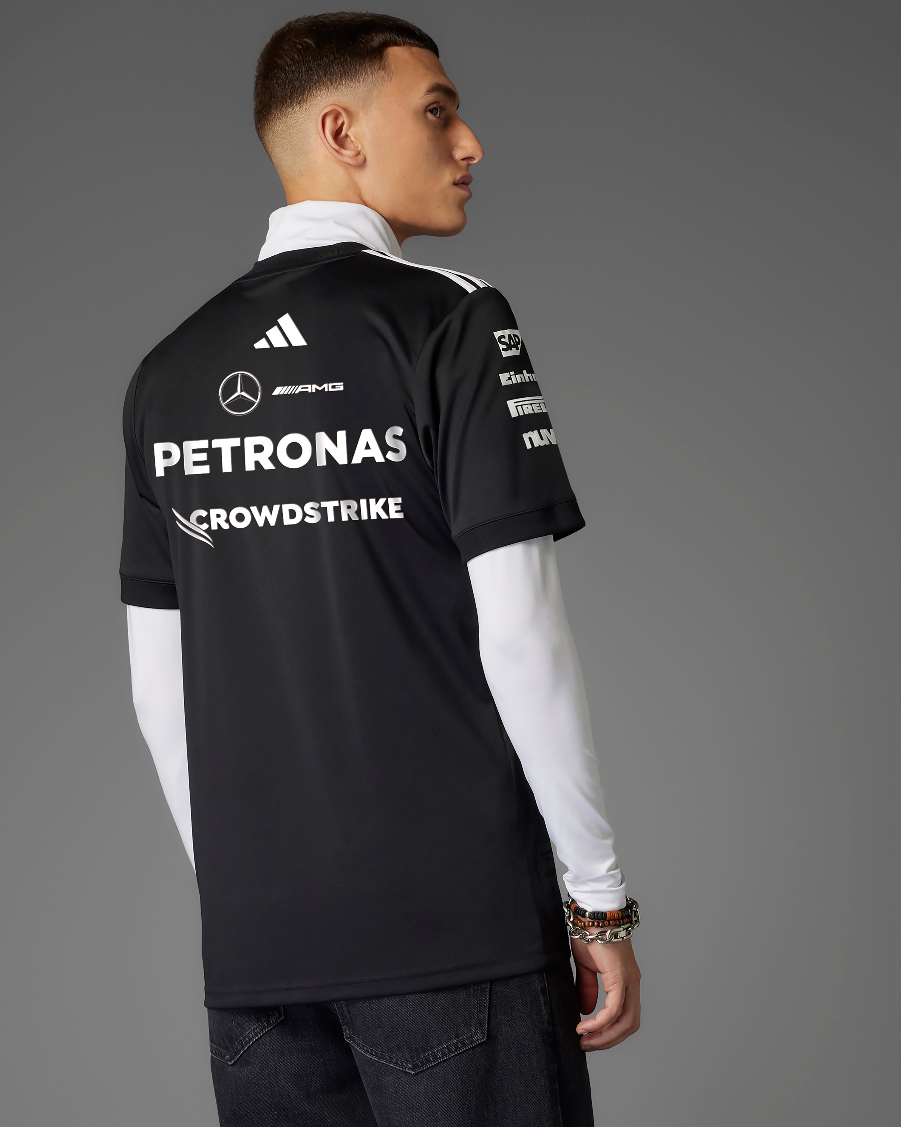 Mens 2025 Team Driver Tee Black — close-up design detail showing Mercedes-AMG PETRONAS F1 styling and product details | Dash Racegear