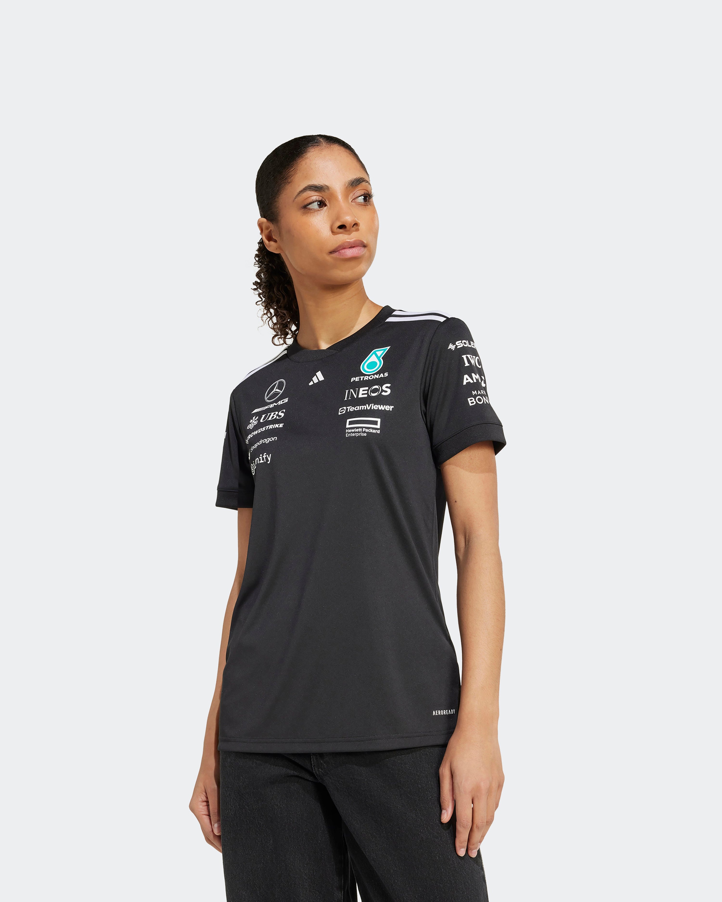 Womens 2025 Team Driver Tee Black — close-up design detail showing Mercedes-AMG PETRONAS F1 styling and product details | Dash Racegear