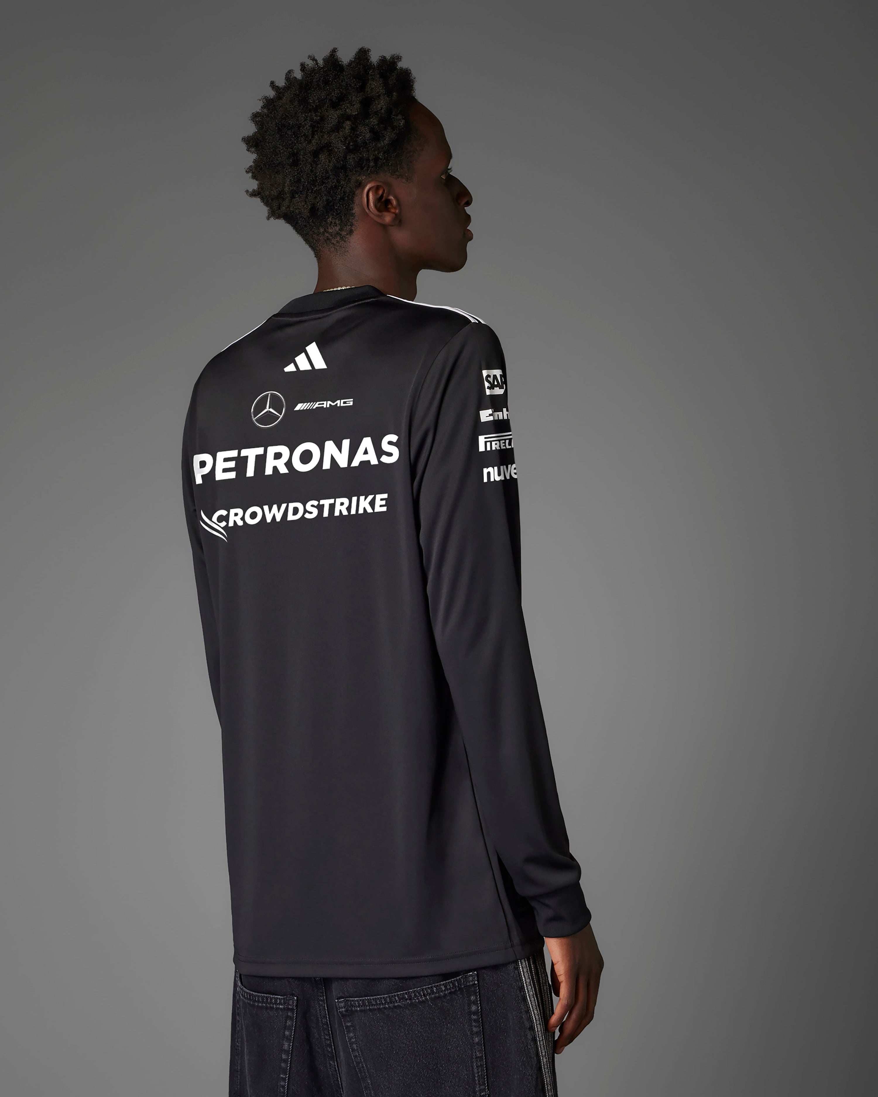 Mens 2025 Team Long Sleeve Driver Tee Black — close-up design detail showing Mercedes-AMG PETRONAS F1 styling and product details | Dash Racegear