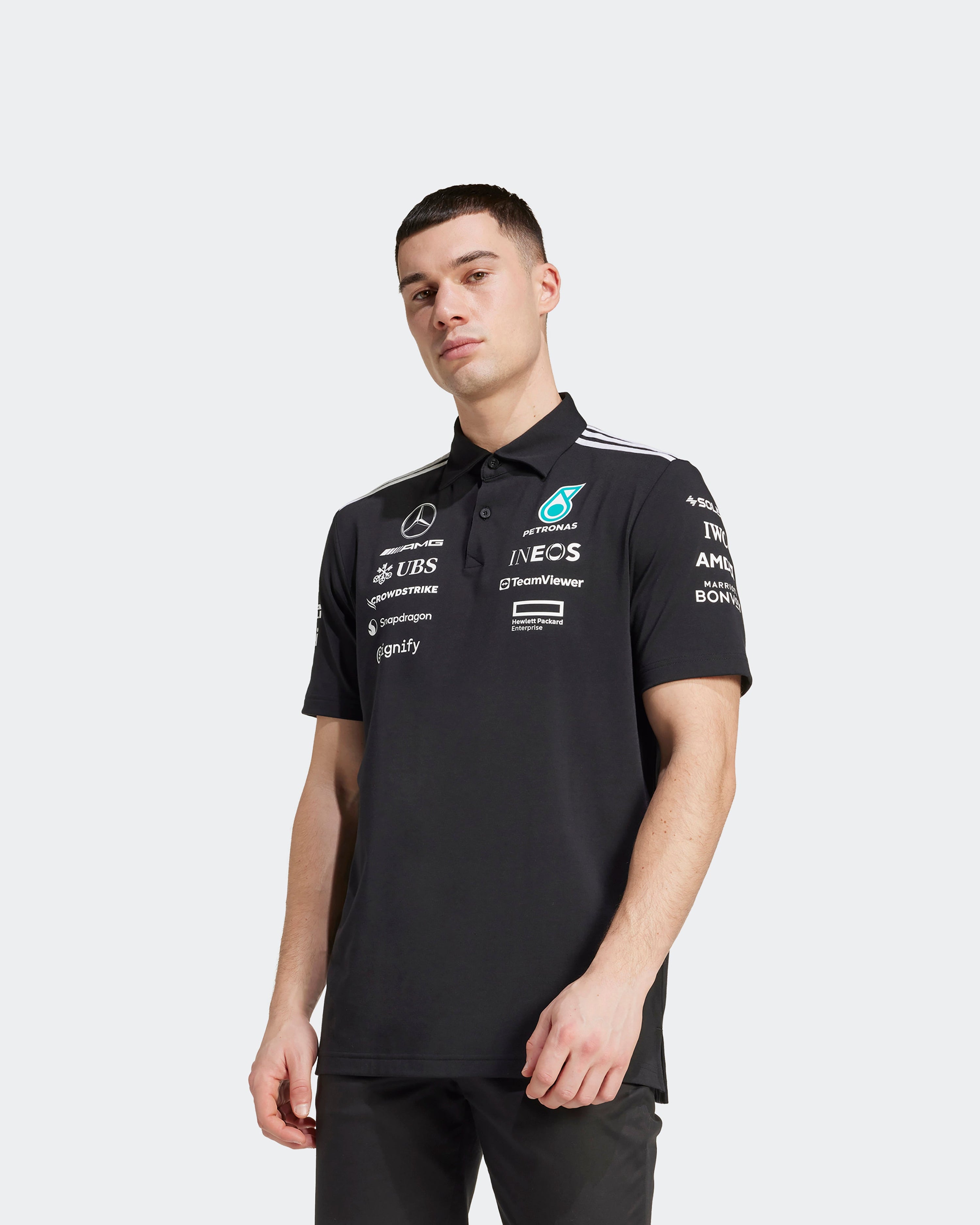 Mens 2025 Team Polo Black — close-up design detail showing Mercedes-AMG PETRONAS F1 styling and product details | Dash Racegear
