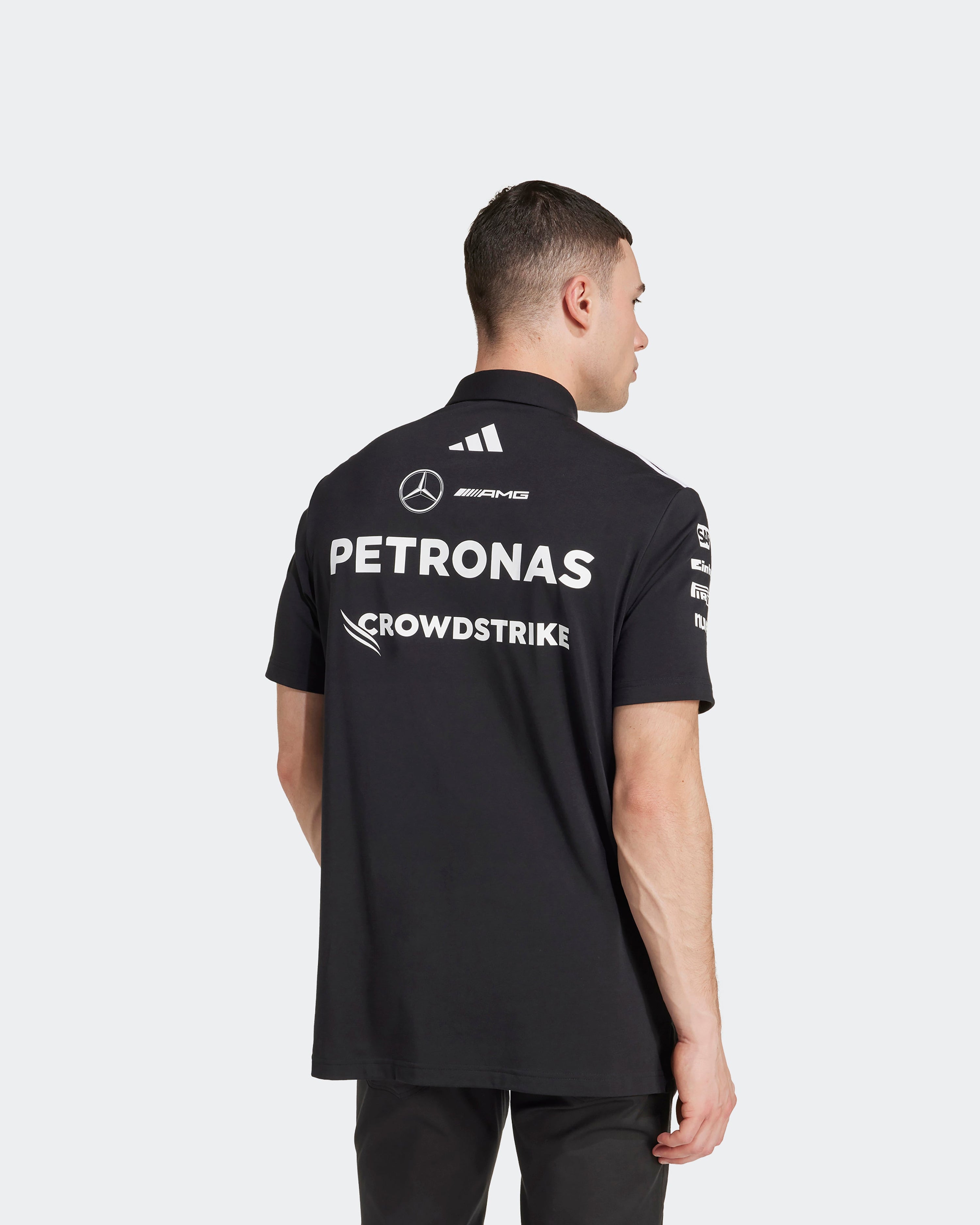 Mens 2025 Team Polo Black — additional product detail showing Mercedes-AMG PETRONAS F1 styling and product details | Dash Racegear