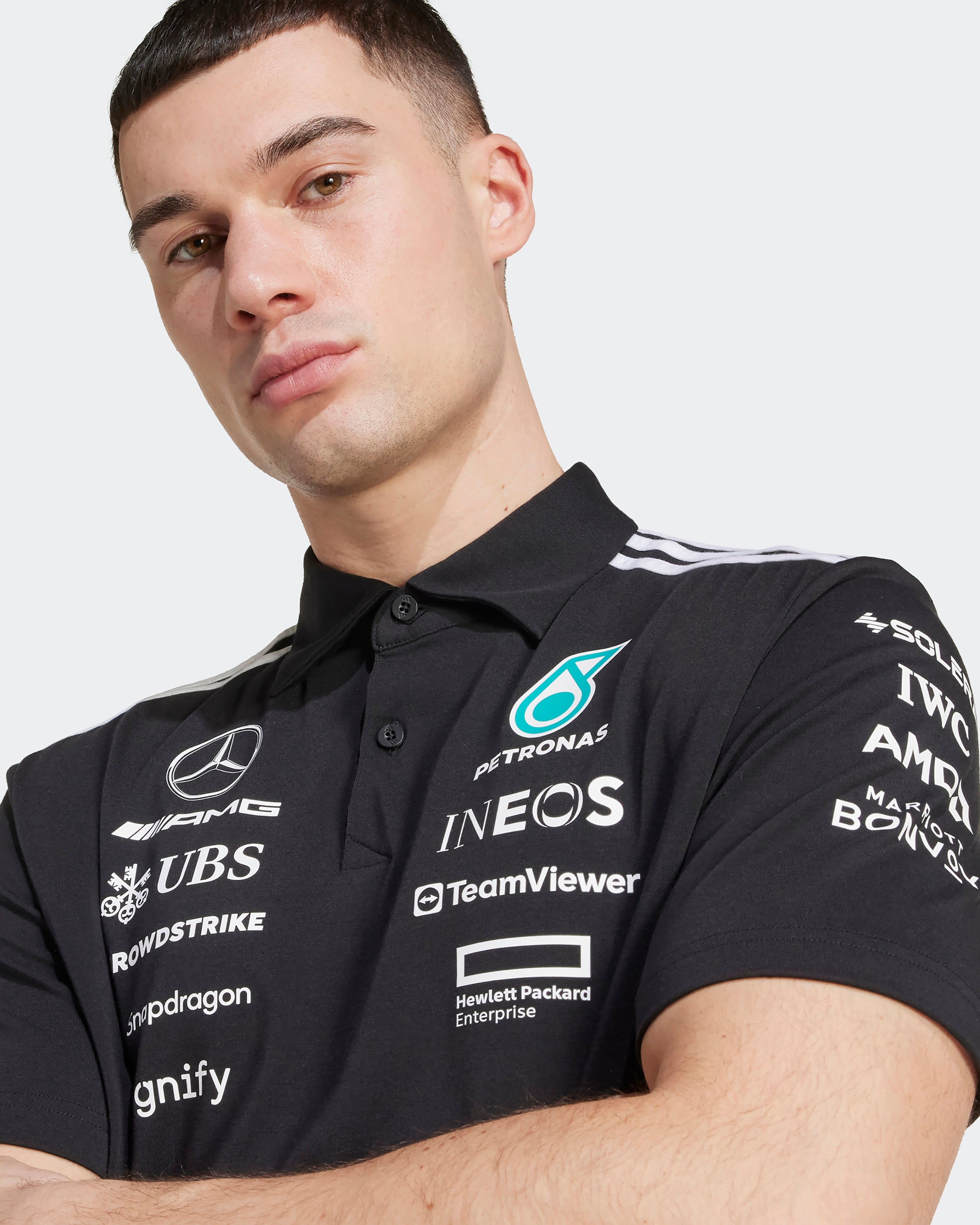 Mens 2025 Team Polo Black — alternate product angle showing Mercedes-AMG PETRONAS F1 styling and product details | Dash Racegear