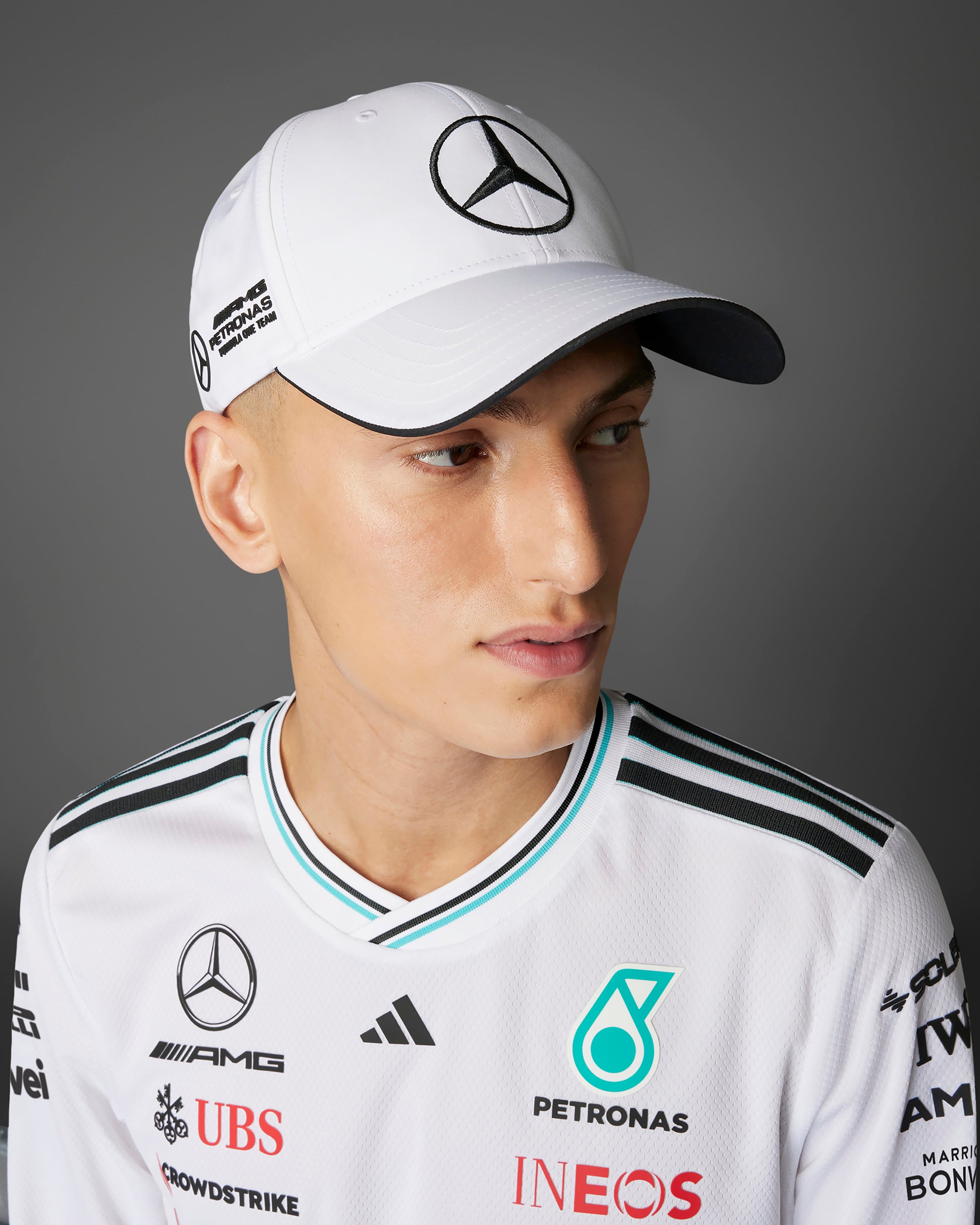 2025 Driver Cap White — close-up design detail showing Mercedes-AMG PETRONAS F1 styling and product details | Dash Racegear