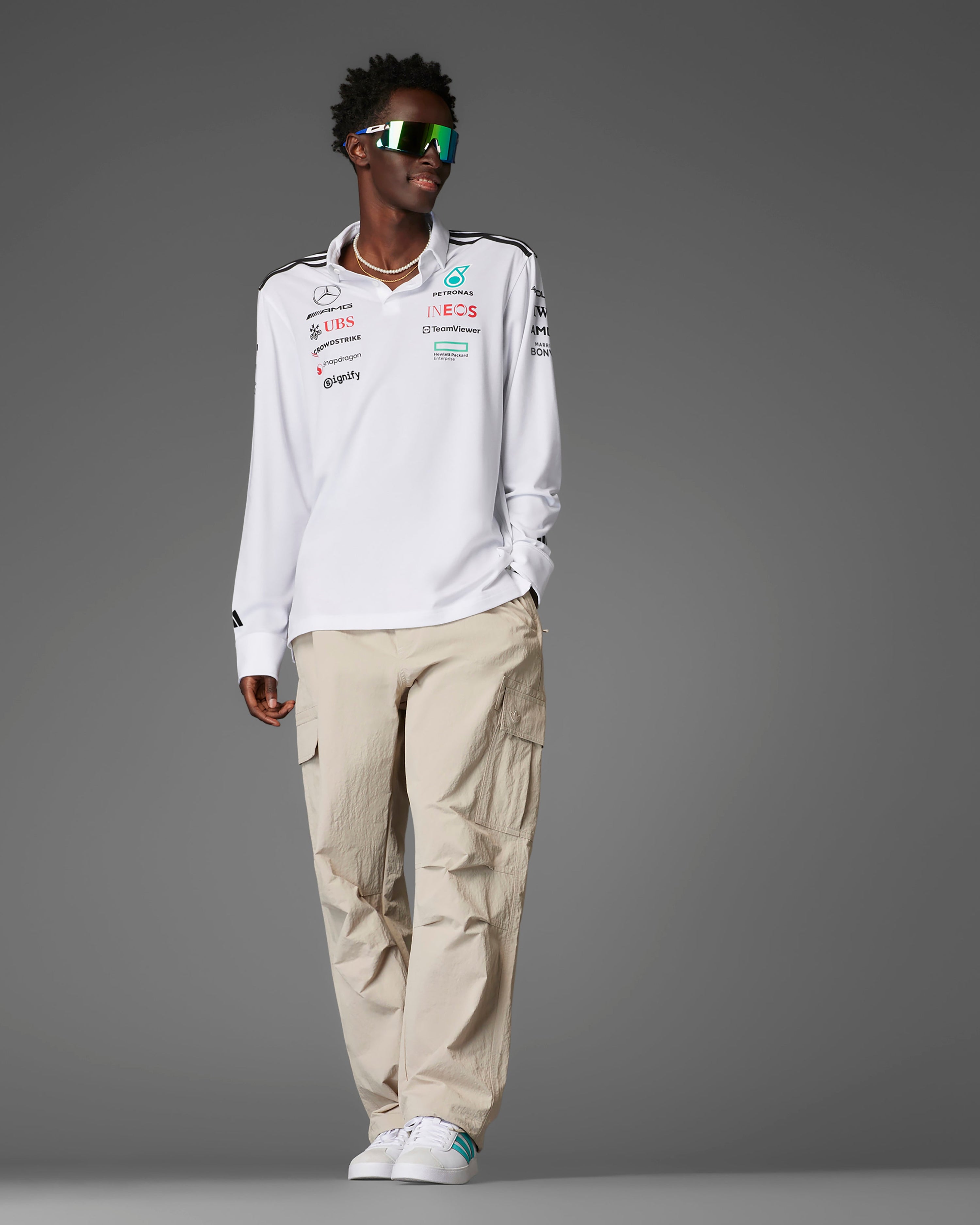 Mens 2025 Team Long Sleeve Polo White — close-up design detail showing Mercedes-AMG PETRONAS F1 styling and product details | Dash Racegear
