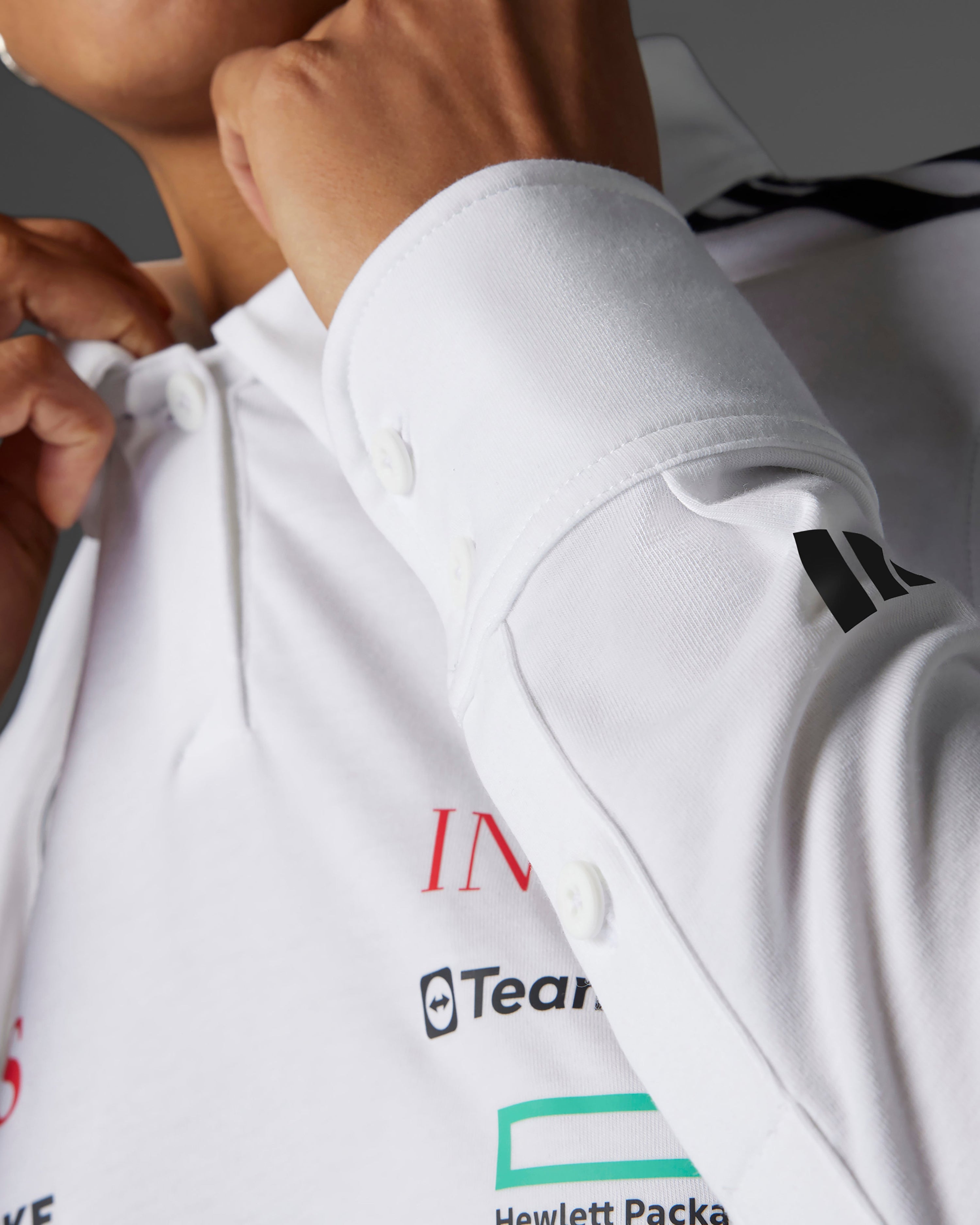 Womens 2025 Team Long Sleeve Polo White — alternate product angle showing Mercedes-AMG PETRONAS F1 styling and product details | Dash Racegear