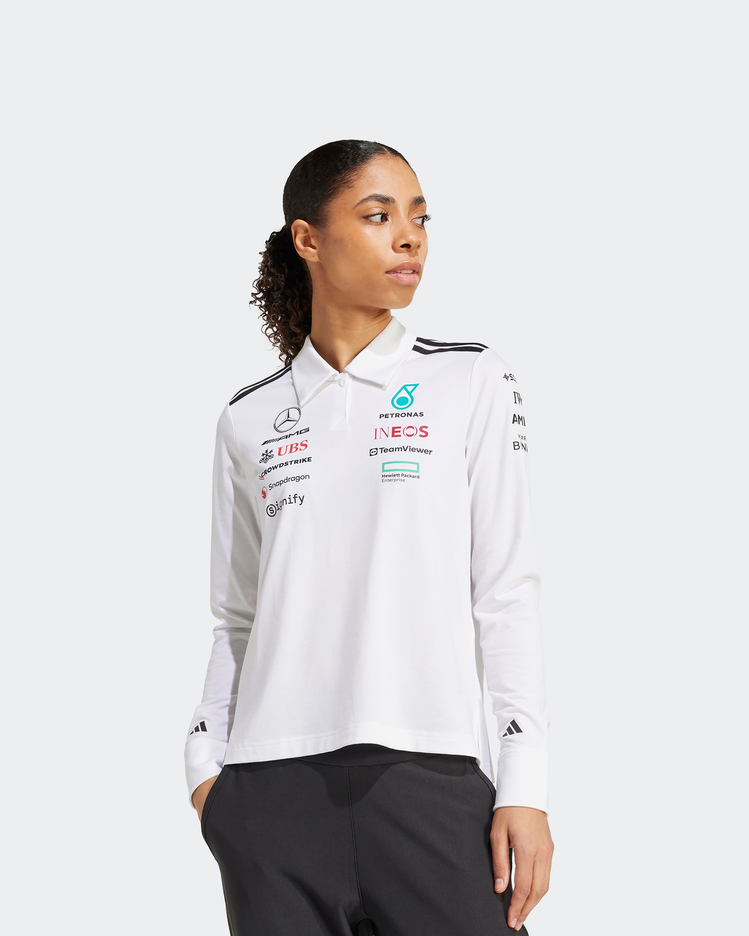 Womens 2025 Team Long Sleeve Polo White — close-up design detail showing Mercedes-AMG PETRONAS F1 styling and product details | Dash Racegear