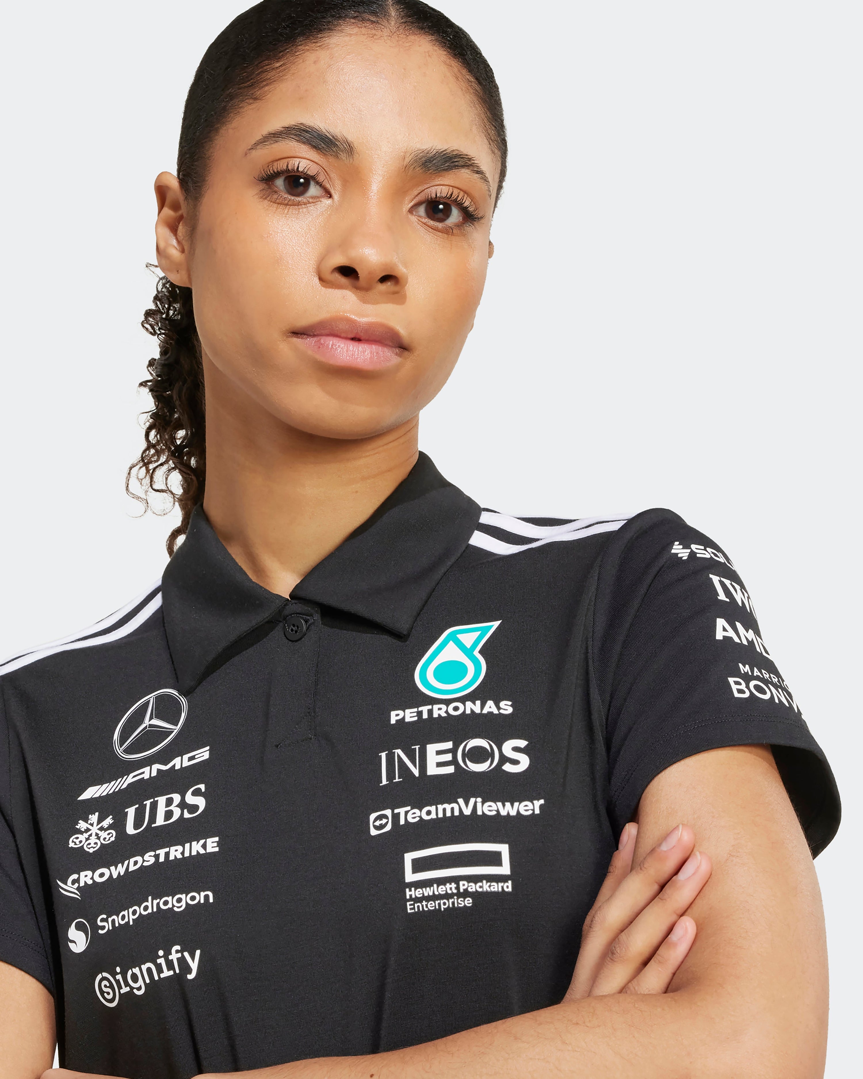 Womens 2025 Team Polo Black — primary product view showing Mercedes-AMG PETRONAS F1 styling and product details | Dash Racegear