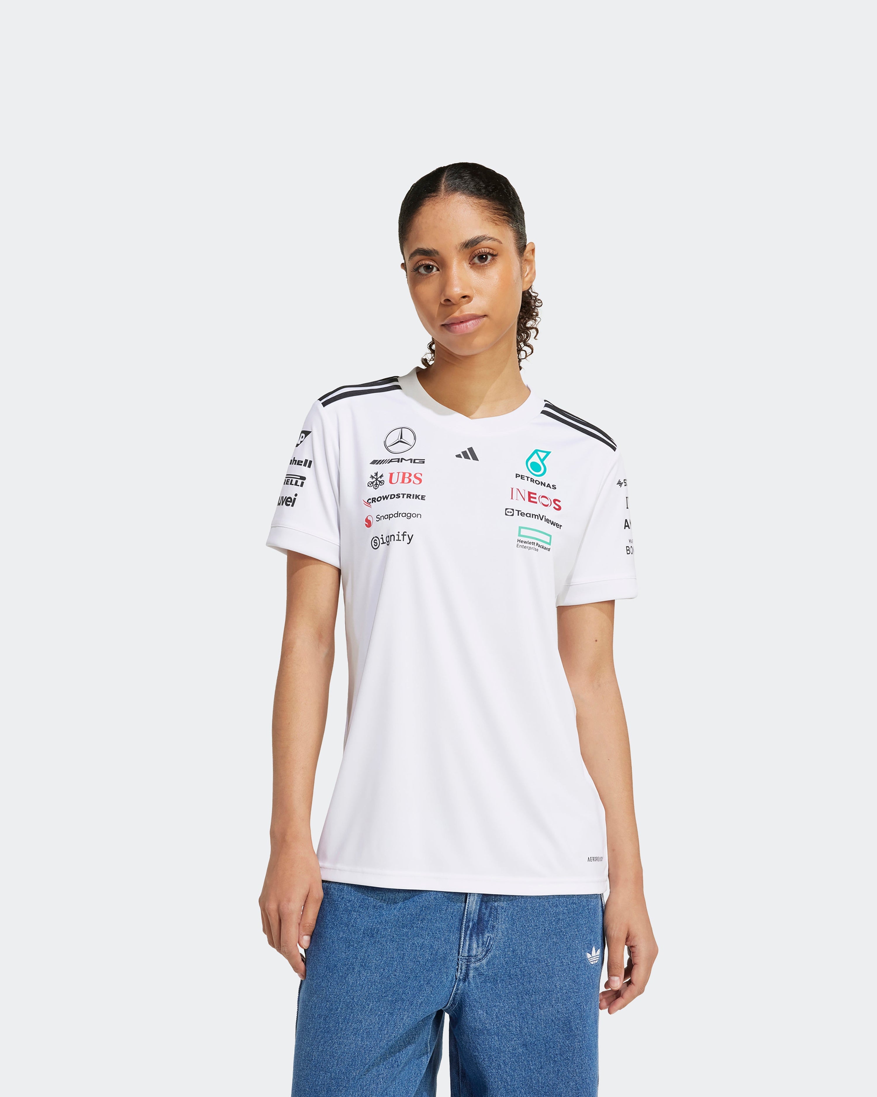 Womens 2025 Team Driver Tee White — close-up design detail showing Mercedes-AMG PETRONAS F1 styling and product details | Dash Racegear