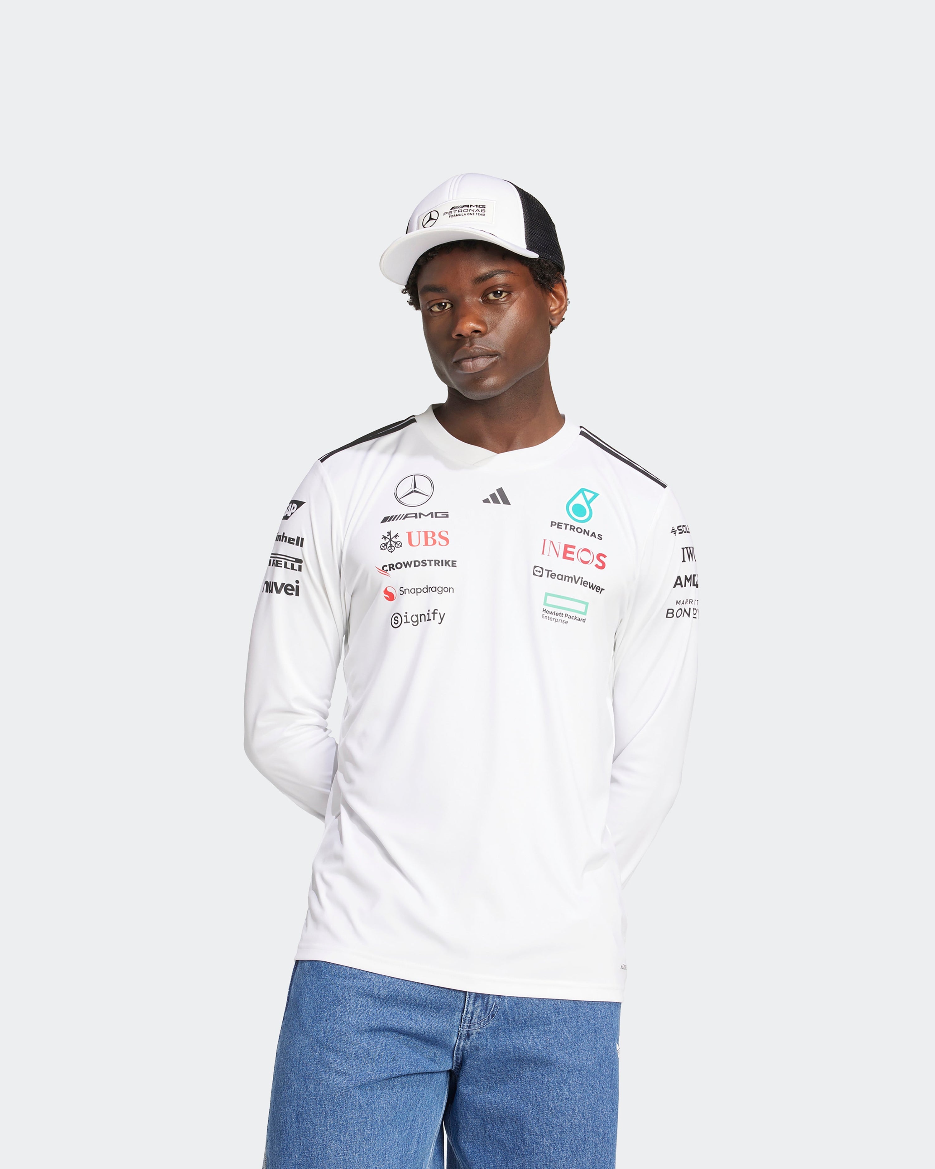 Mens 2025 Team Long Sleeve Driver Tee White — close-up design detail showing Mercedes-AMG PETRONAS F1 styling and product details | Dash Racegear