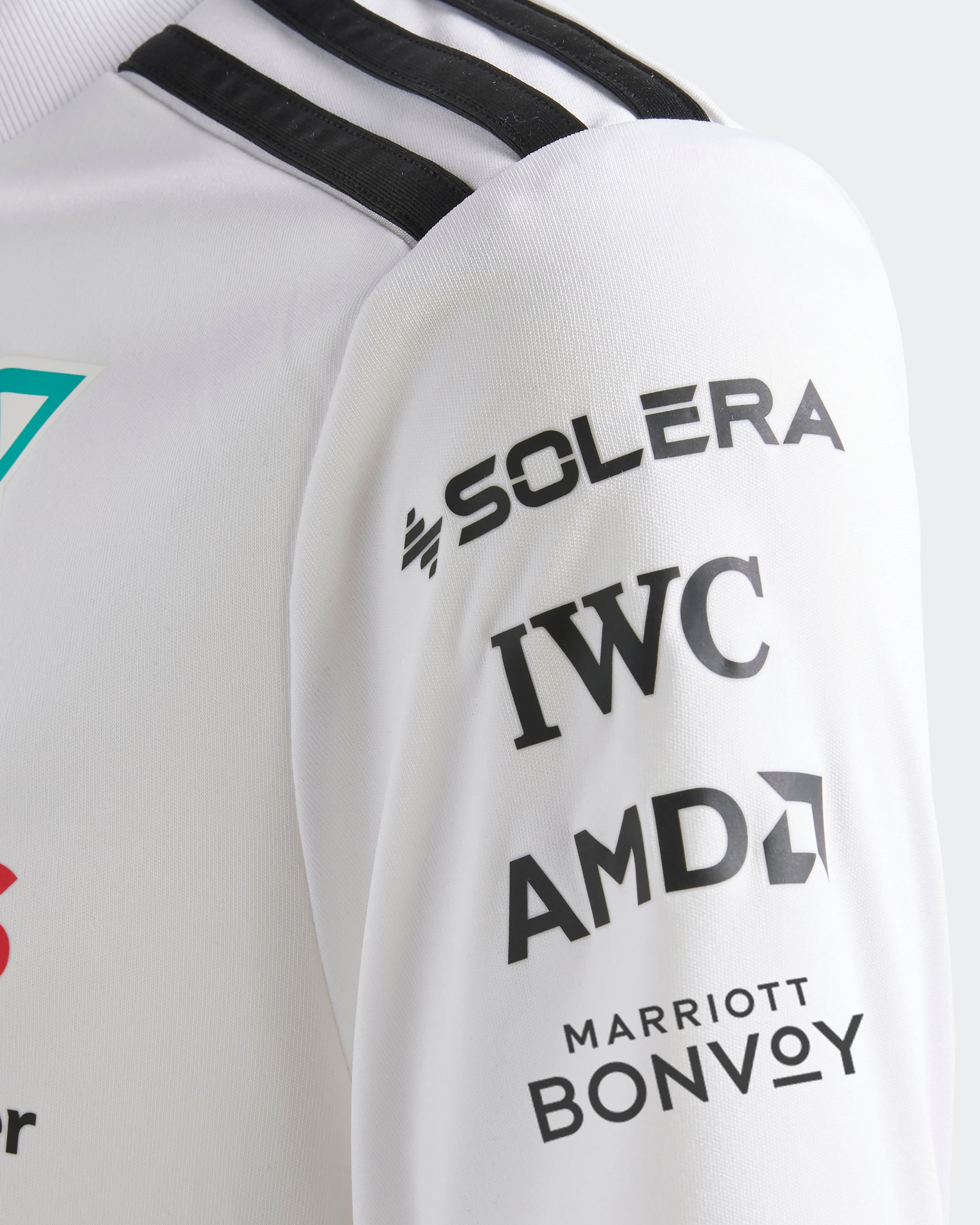 Kids 2025 Team Driver Tee White — close-up design detail showing Mercedes-AMG PETRONAS F1 styling and product details | Dash Racegear