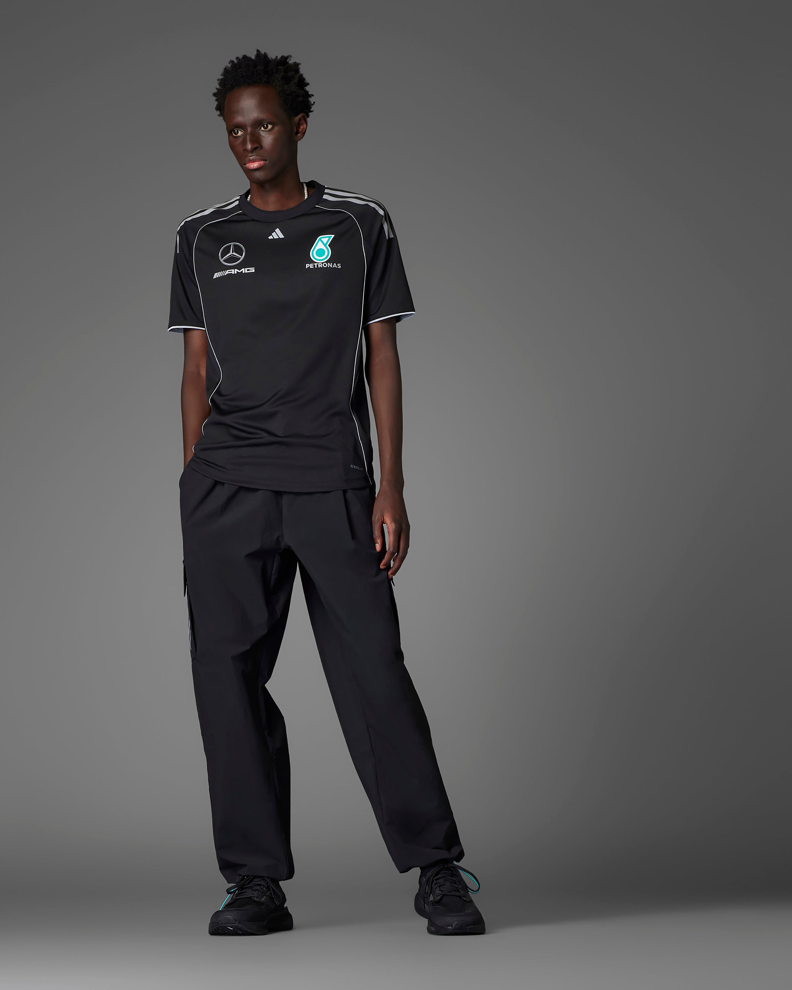 Mens 2025 Mechanics Tee Black — close-up design detail showing Mercedes-AMG PETRONAS F1 styling and product details | Dash Racegear