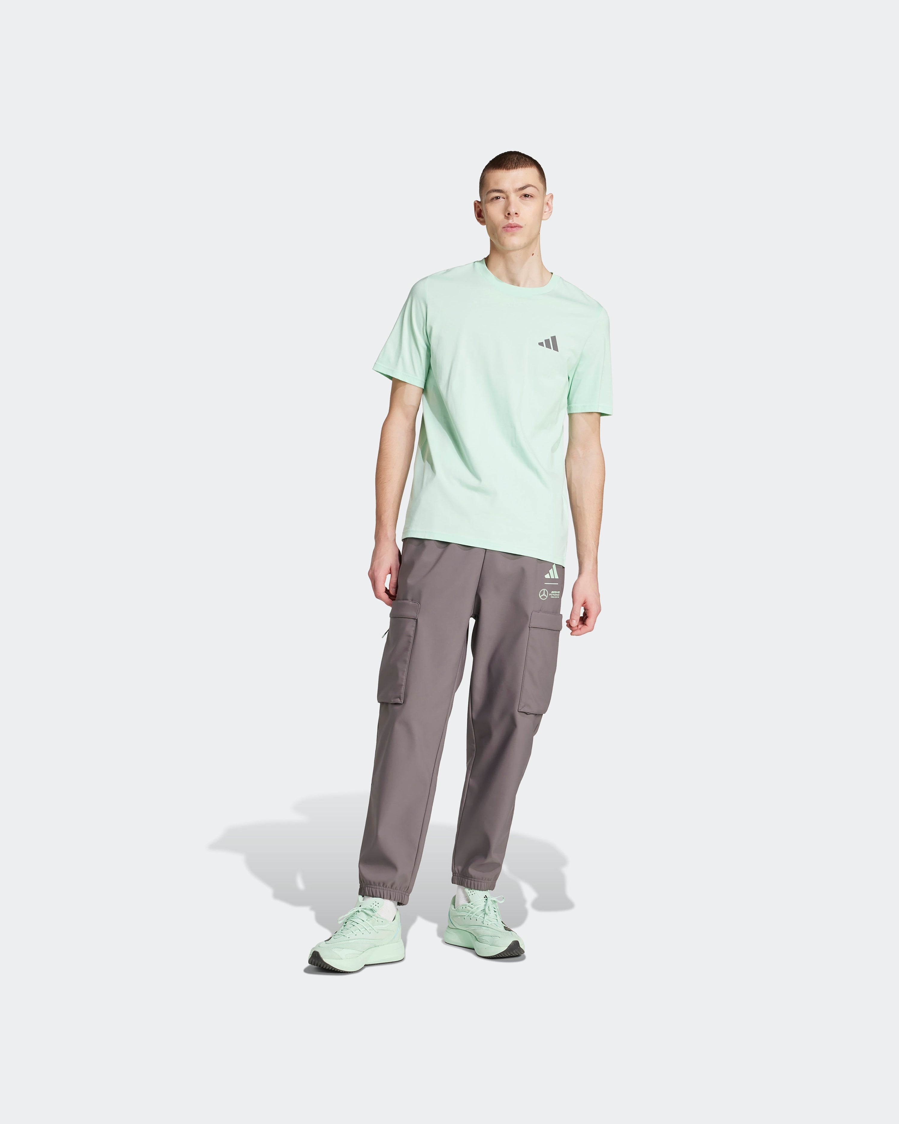 Mens Premium Woven Graphic T-Shirt Green — close-up design detail showing Mercedes-AMG PETRONAS F1 styling and product details | Dash Racegear