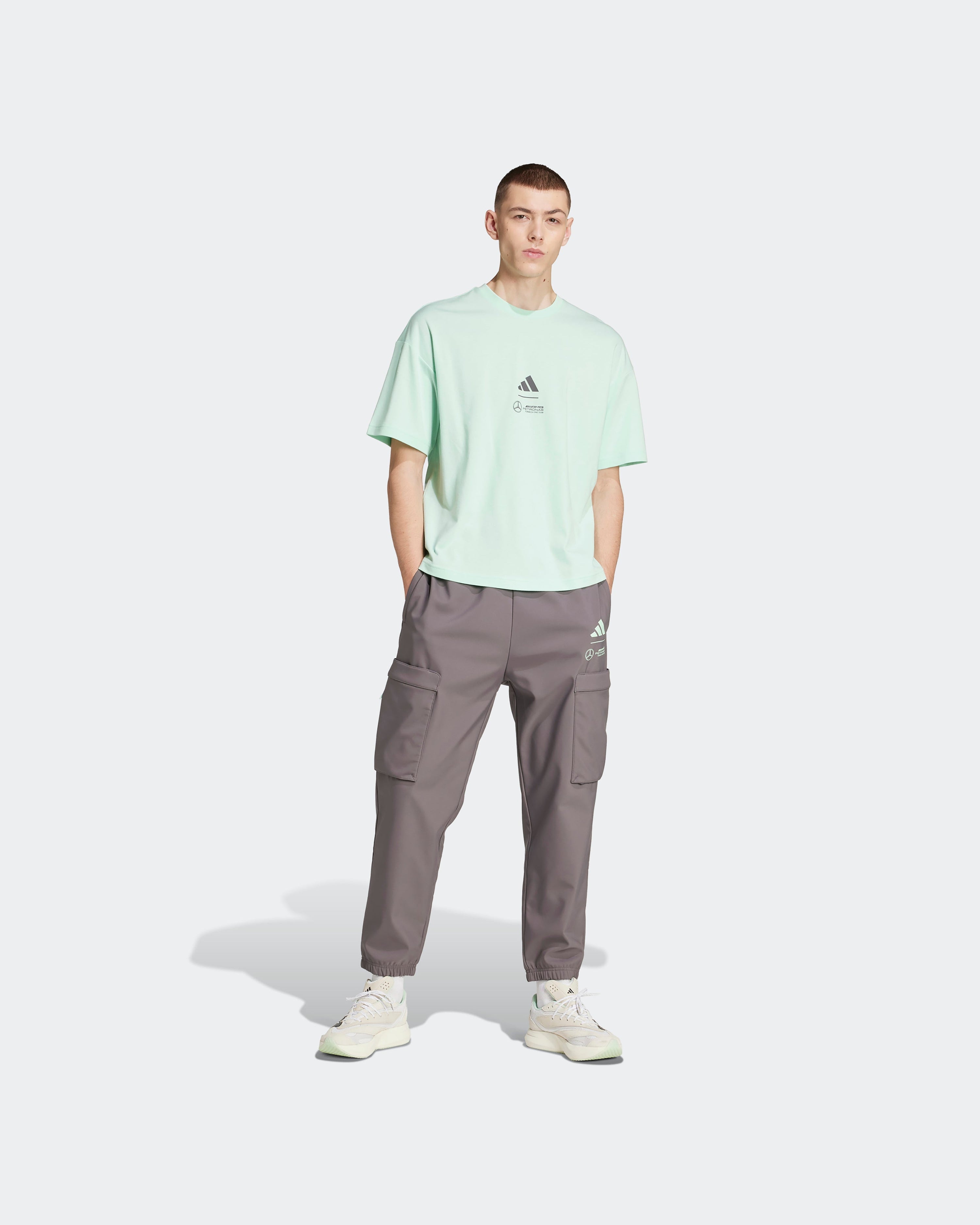 Mens Premium Woven T-Shirt Green — close-up design detail showing Mercedes-AMG PETRONAS F1 styling and product details | Dash Racegear