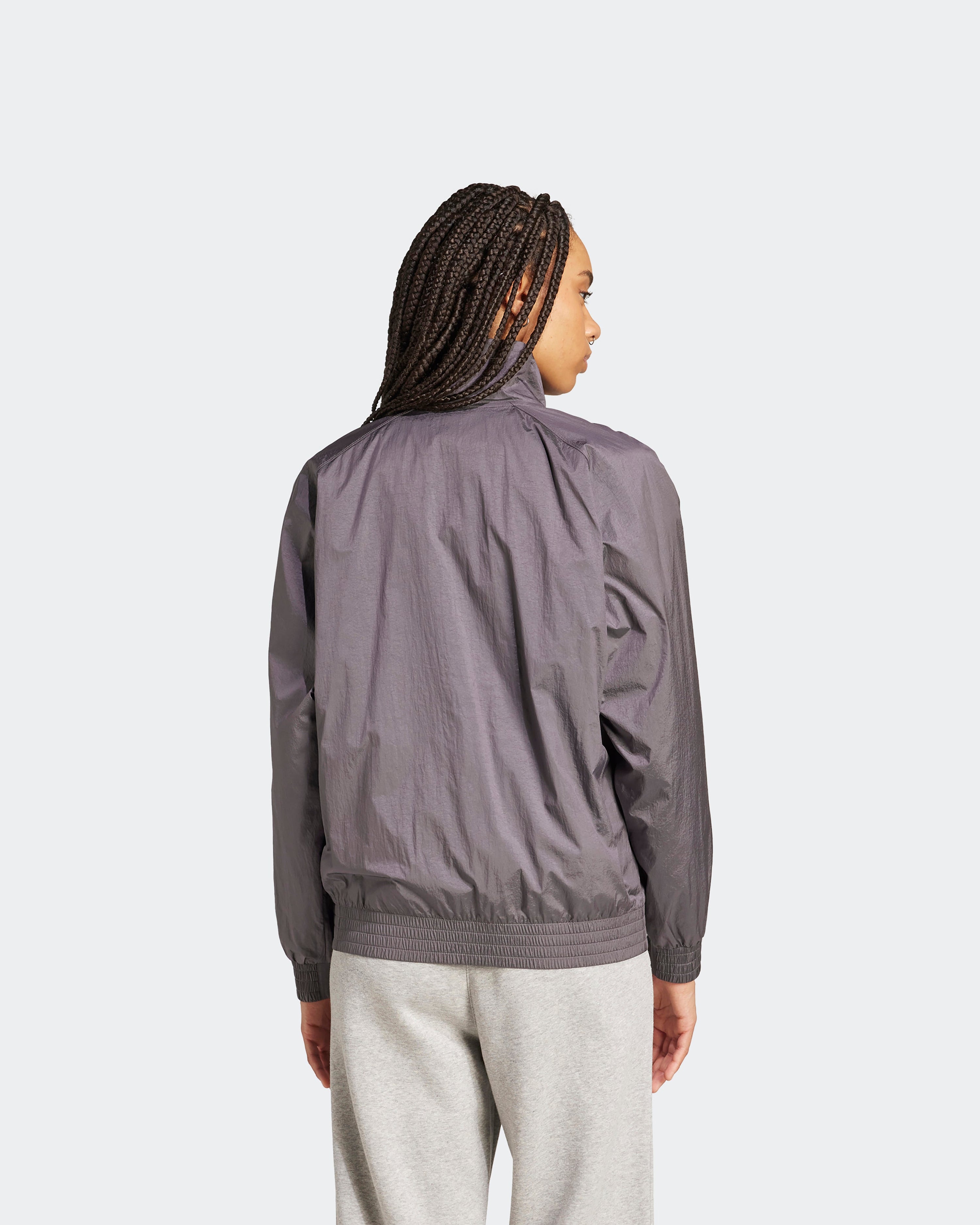 Womens Premium Woven Track Top Grey — close-up design detail showing Mercedes-AMG PETRONAS F1 styling and product details | Dash Racegear
