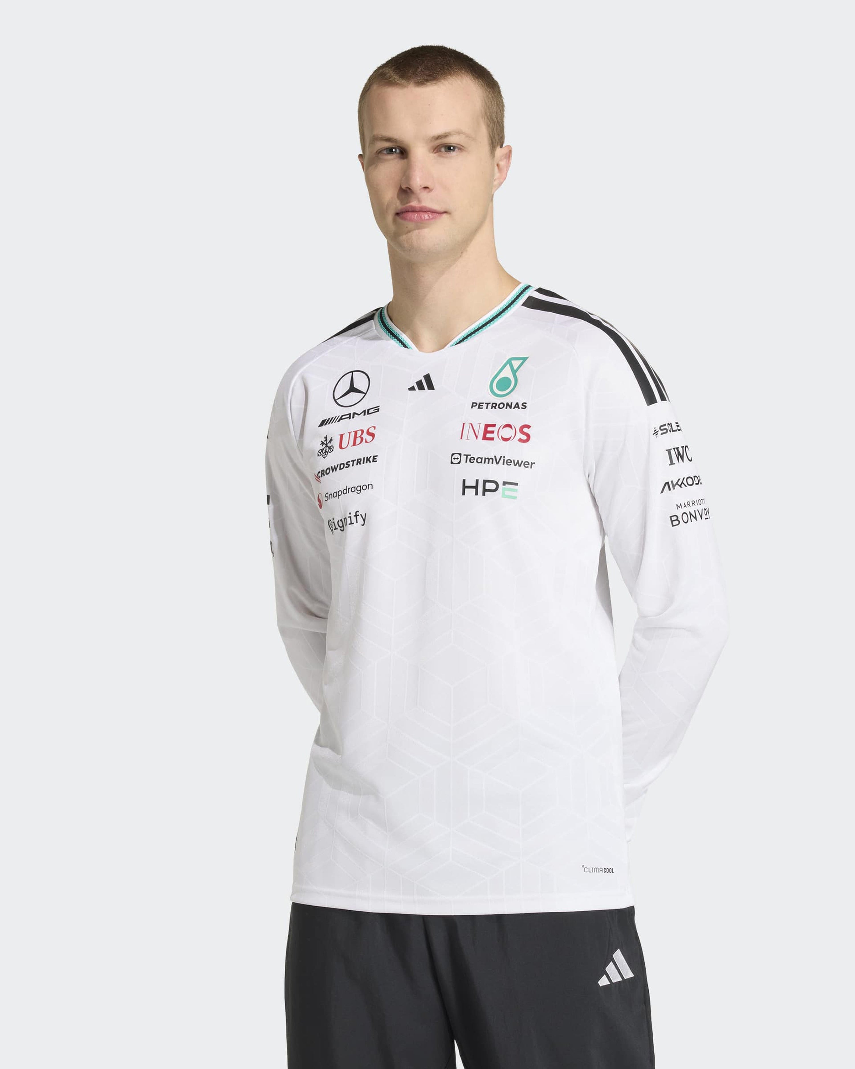 Mens 2026 Authentic Long-Sleeve Driver Tee White — close-up design detail showing Mercedes-AMG PETRONAS F1 styling and product details | Dash Racegear