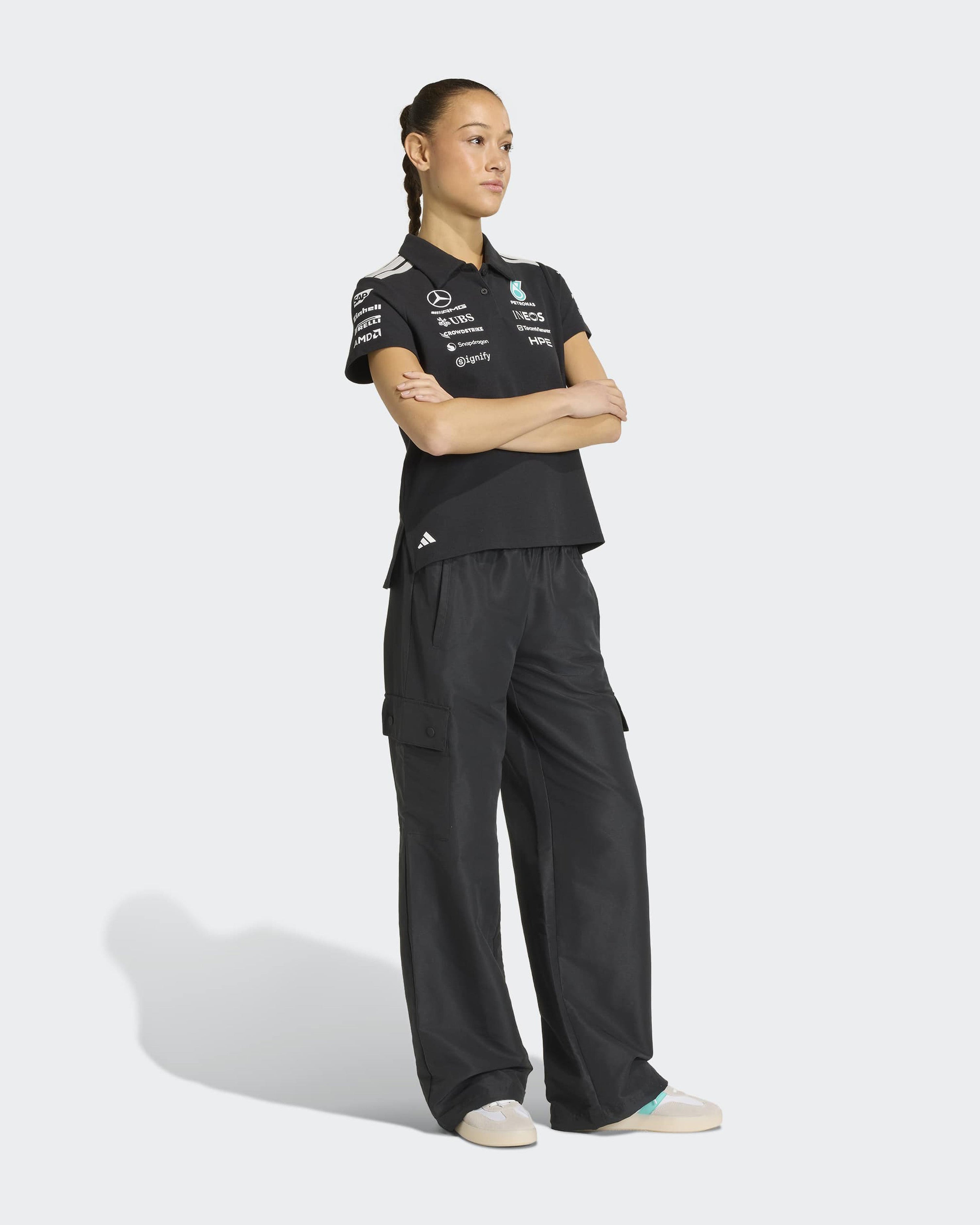 Womens 2026 Team Polo Black — close-up design detail showing Mercedes-AMG PETRONAS F1 styling and product details | Dash Racegear