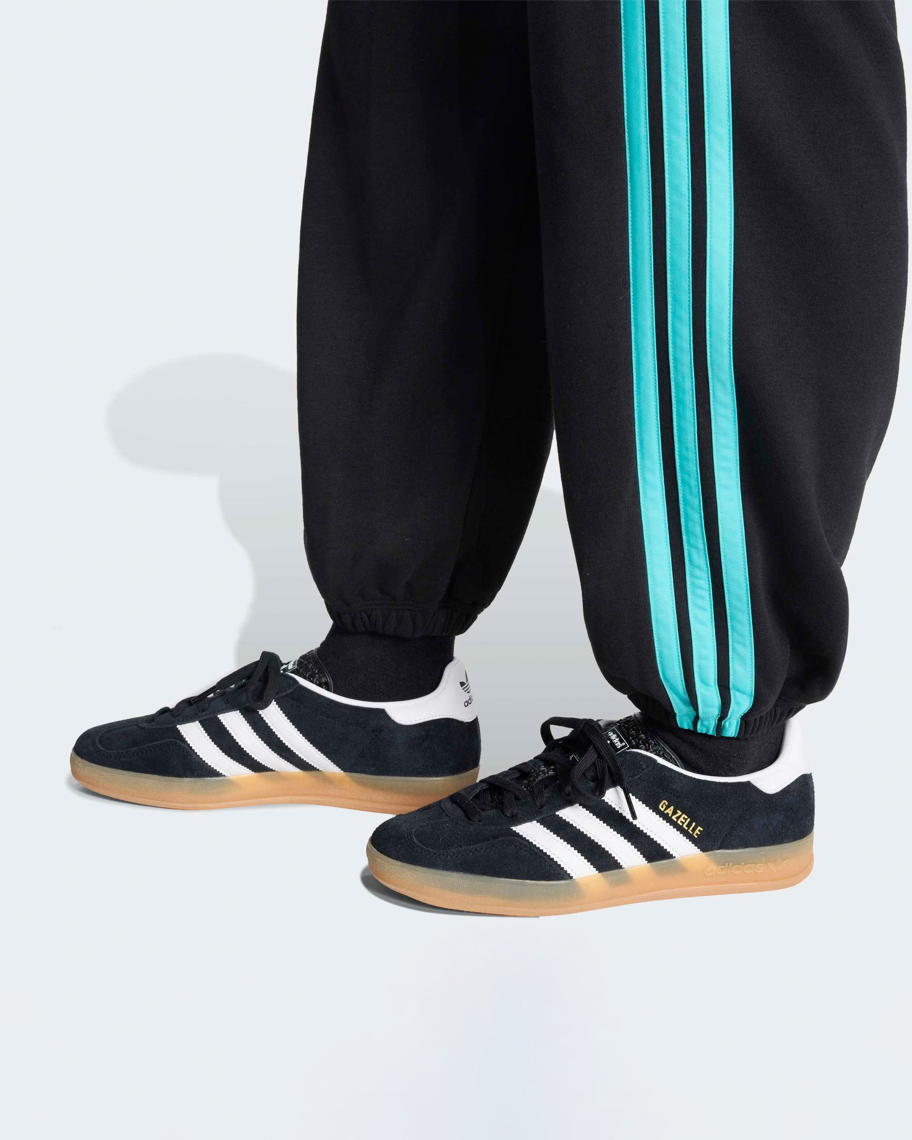 Womens DNA Pants Black — close-up design detail showing Mercedes-AMG PETRONAS F1 styling and product details | Dash Racegear
