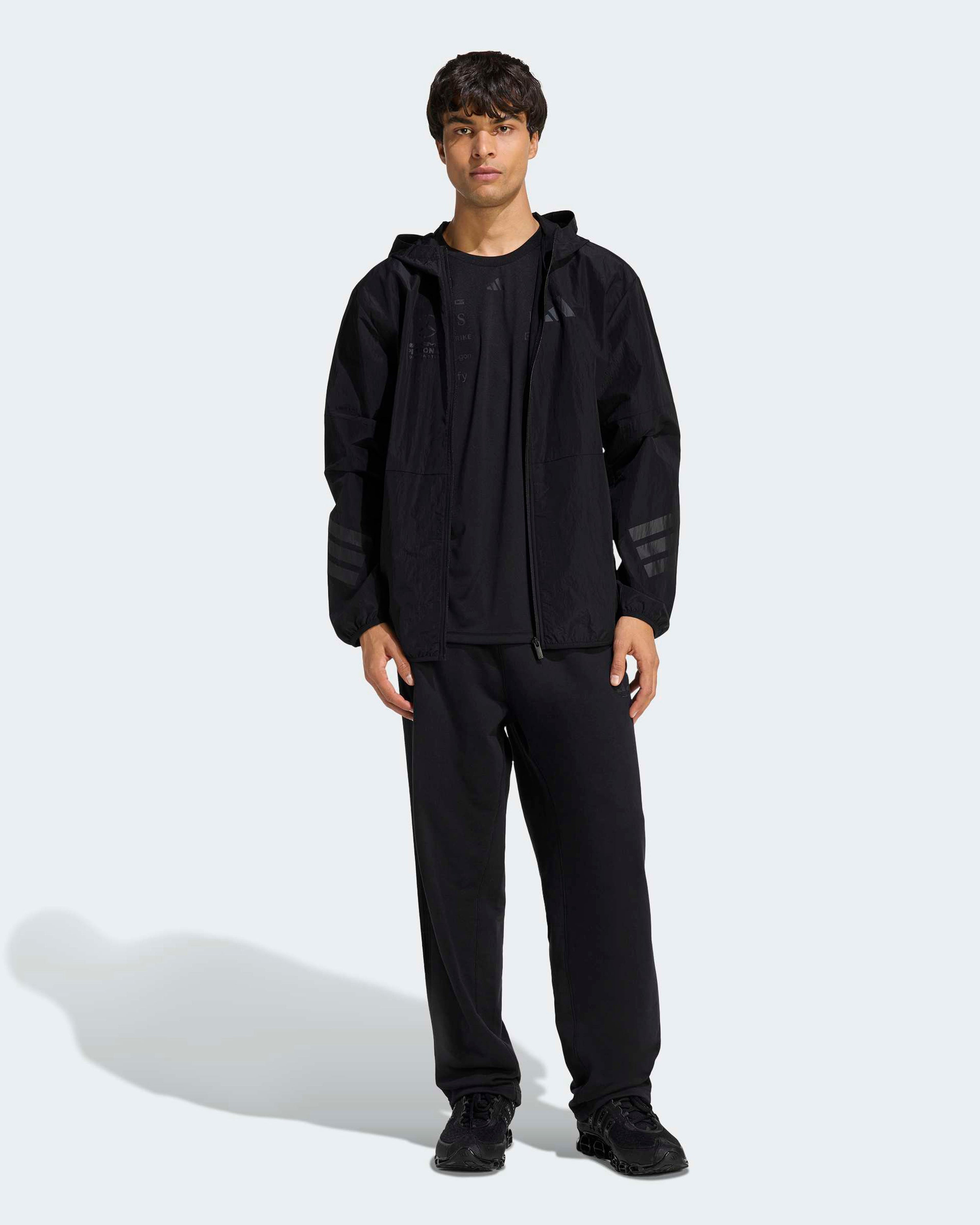 Mens Night Windbreaker Black — close-up design detail showing Mercedes-AMG PETRONAS F1 styling and product details | Dash Racegear