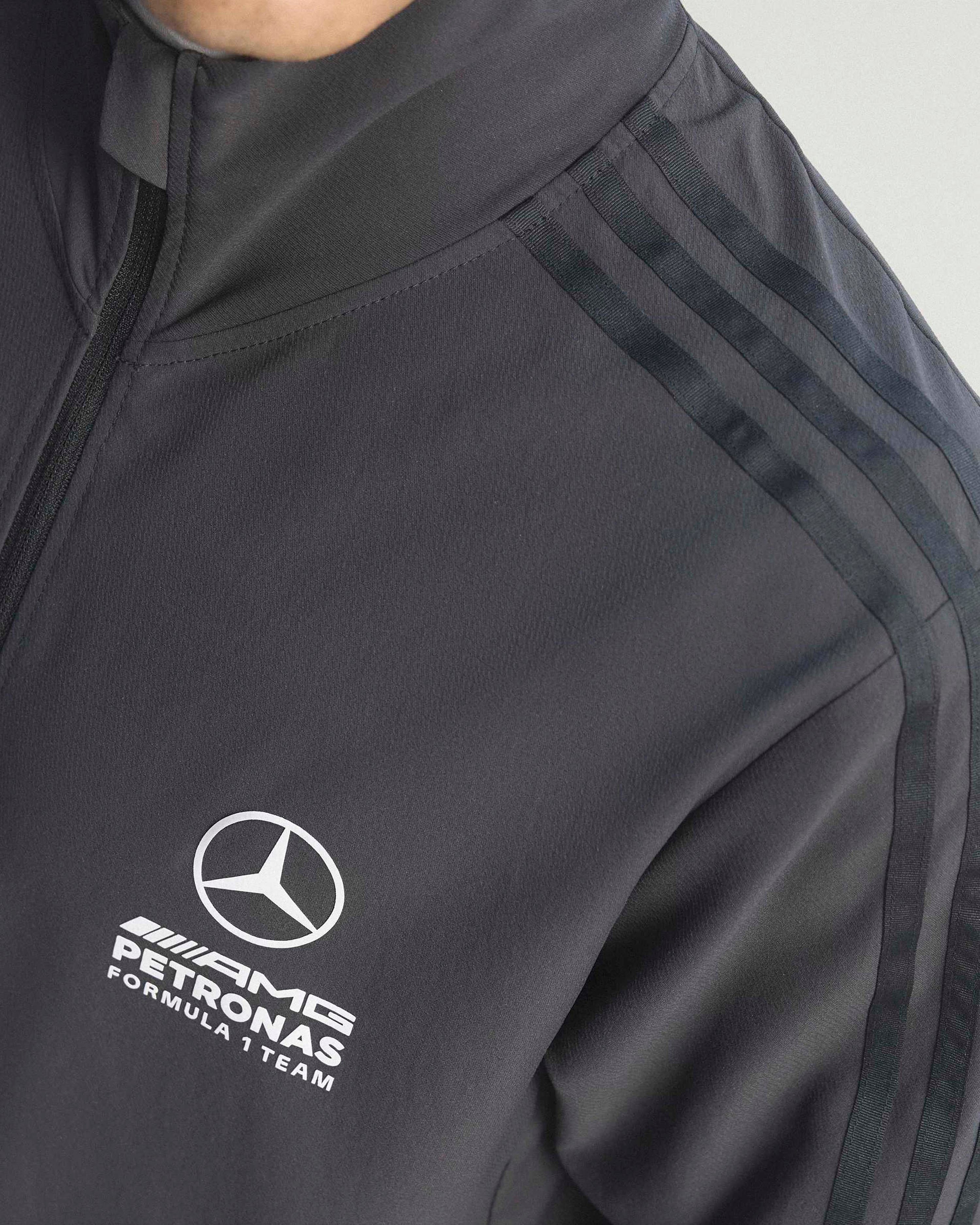 Mens Giro Di Mercedes Track Top Black — close-up design detail showing Mercedes-AMG PETRONAS F1 styling and product details | Dash Racegear