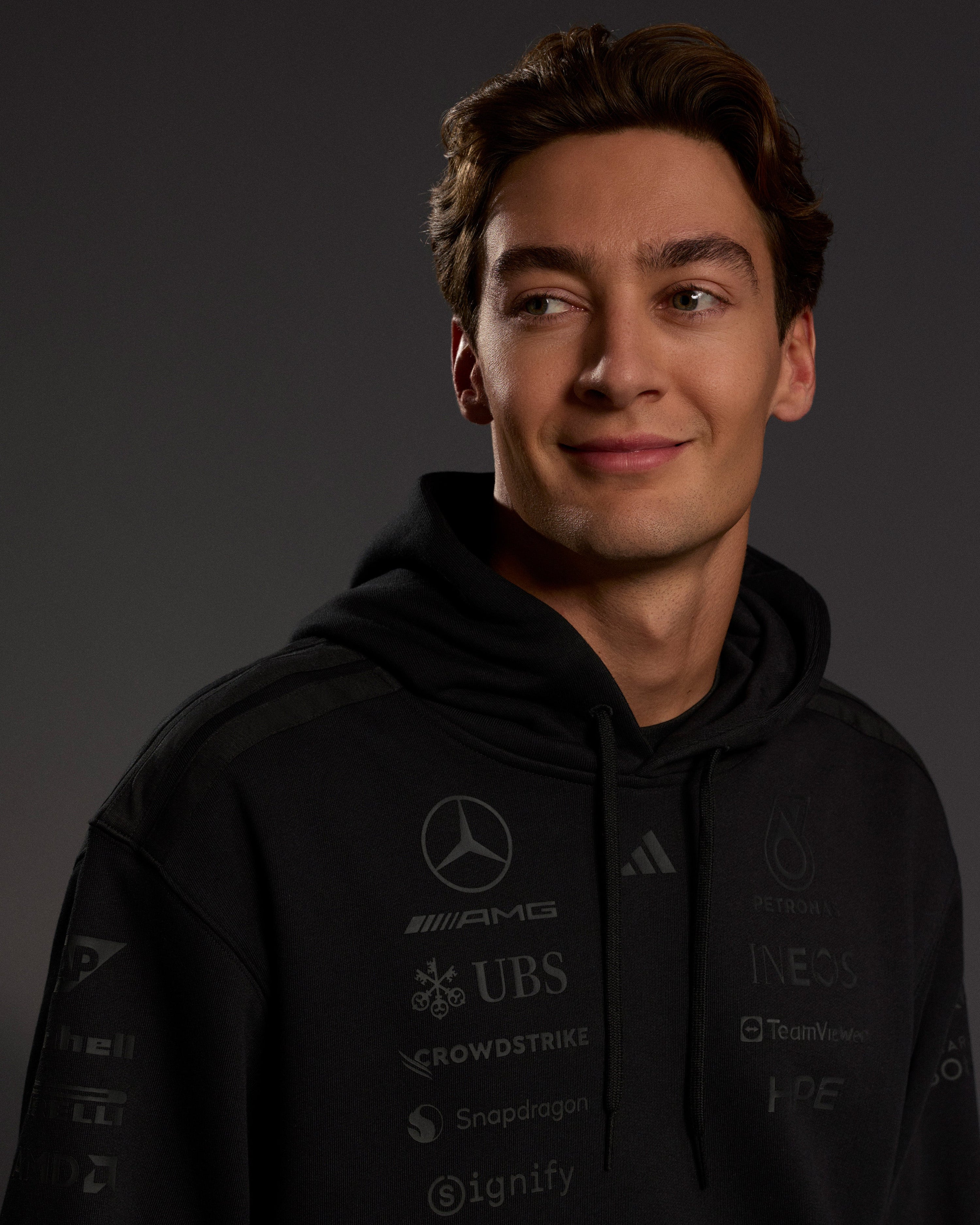 Mens 2026 Night Team Hoody Black — close-up design detail showing Mercedes-AMG PETRONAS F1 styling and product details | Dash Racegear