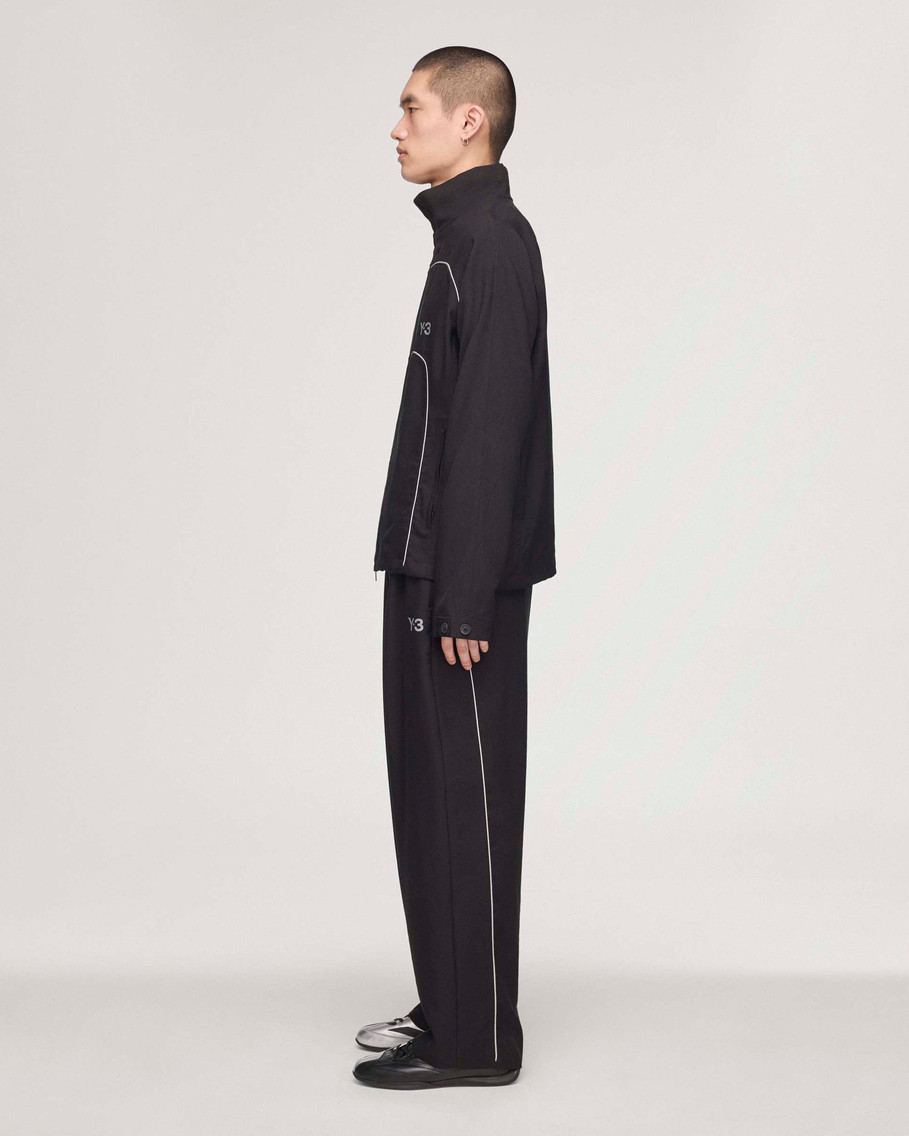 Y-3 Track Pants Black — close-up design detail showing Mercedes-AMG PETRONAS F1 styling and product details | Dash Racegear