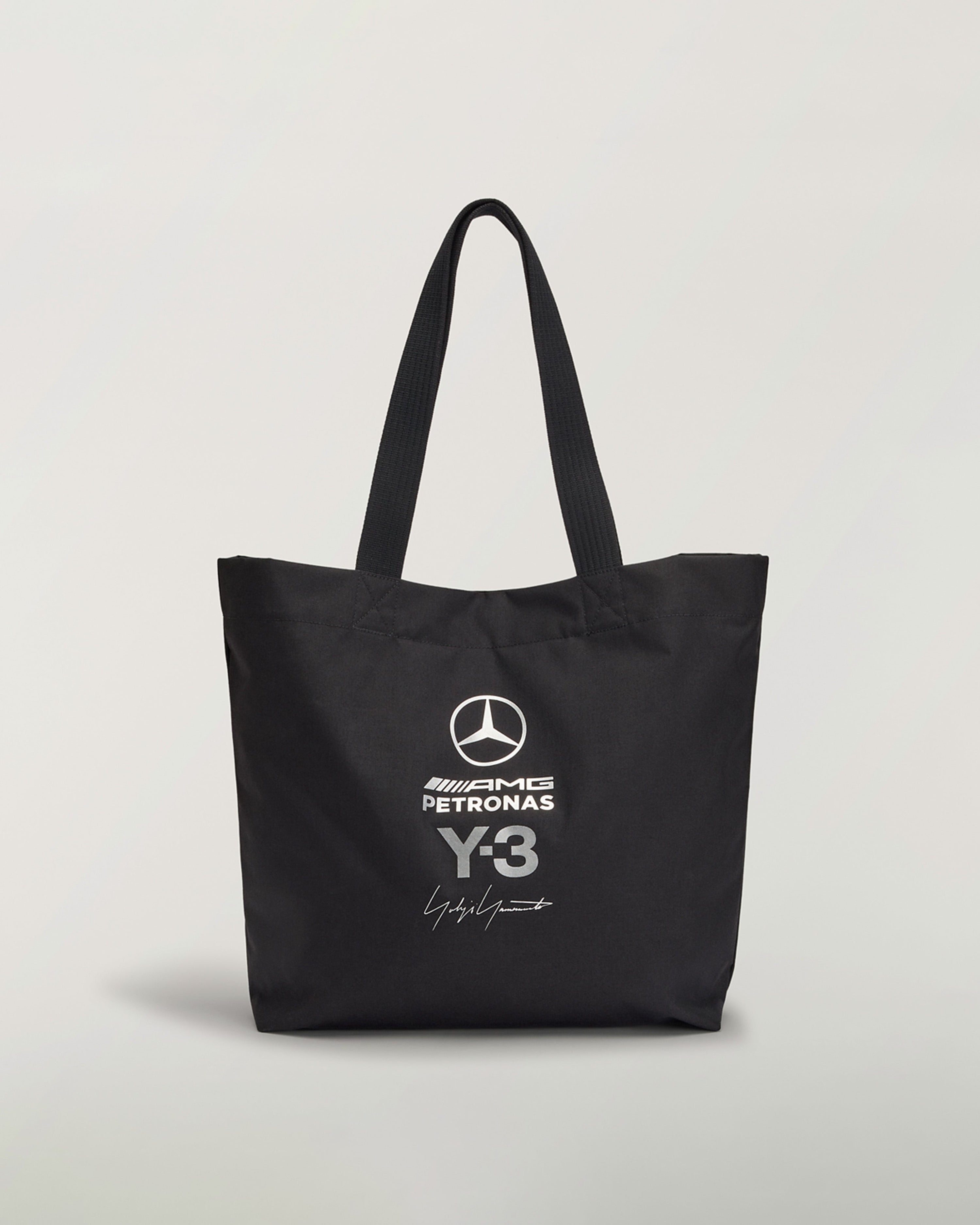 Y-3 Tote Bag Black — primary product view showing Mercedes-AMG PETRONAS F1 styling and product details | Dash Racegear