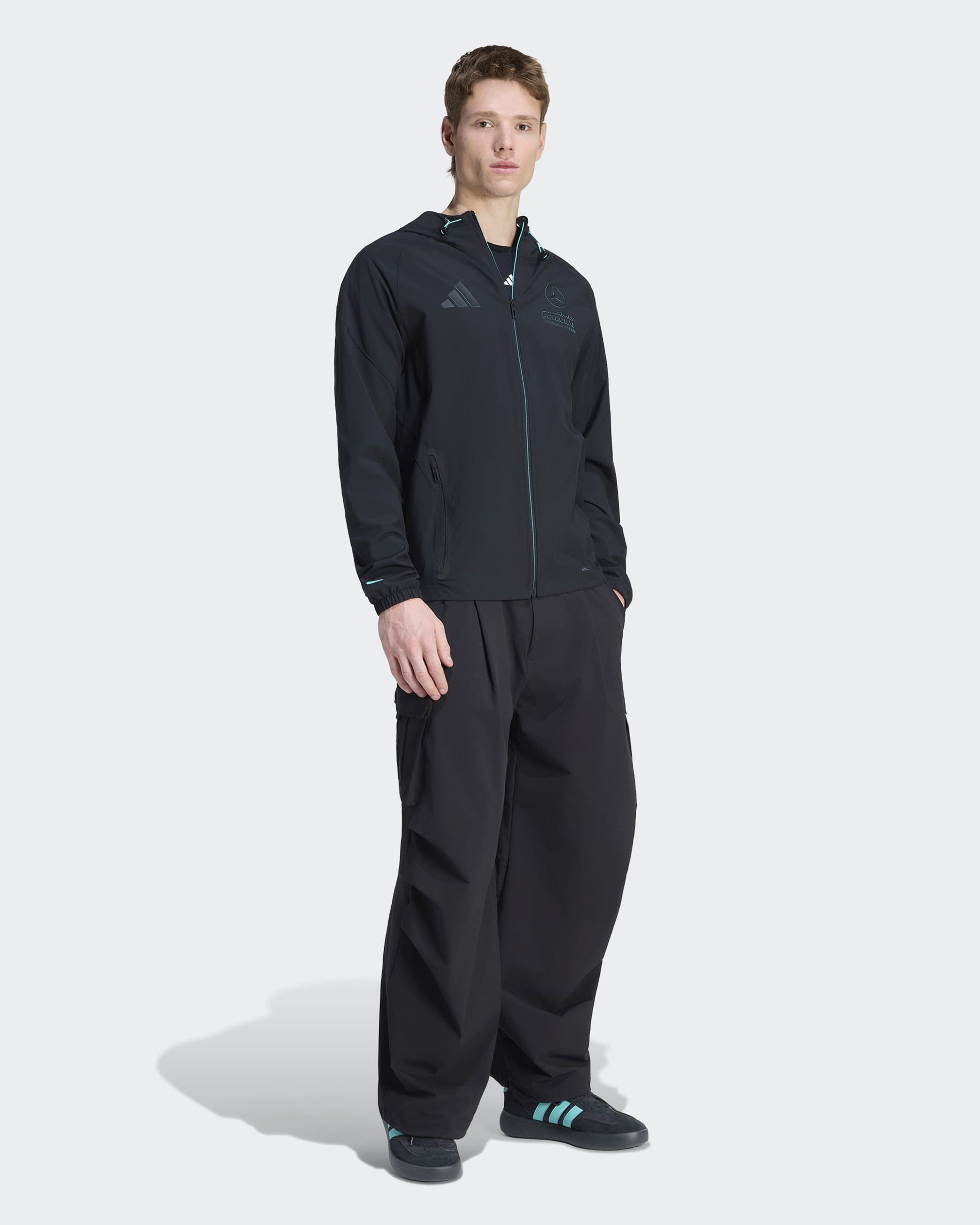 Mens Night Vis Tech Jacket Black — close-up design detail showing Mercedes-AMG PETRONAS F1 styling and product details | Dash Racegear