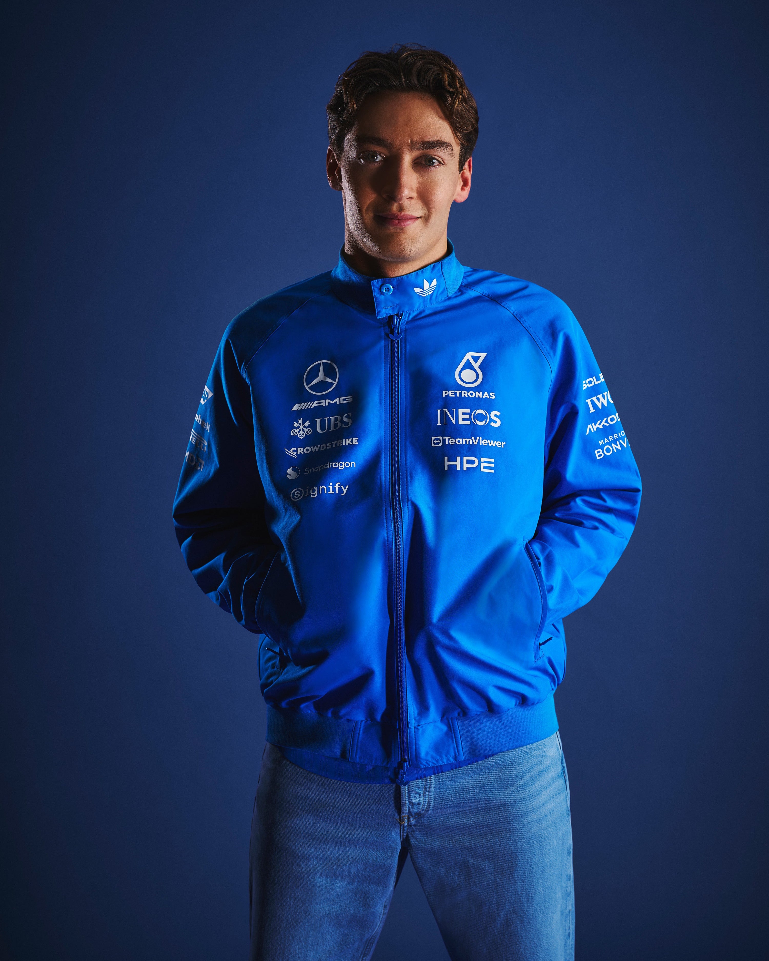 Mens 2026 Blue Wonder Team Harrington Jacket Blue — close-up design detail showing Mercedes-AMG PETRONAS F1 styling and product details | Dash Racegear