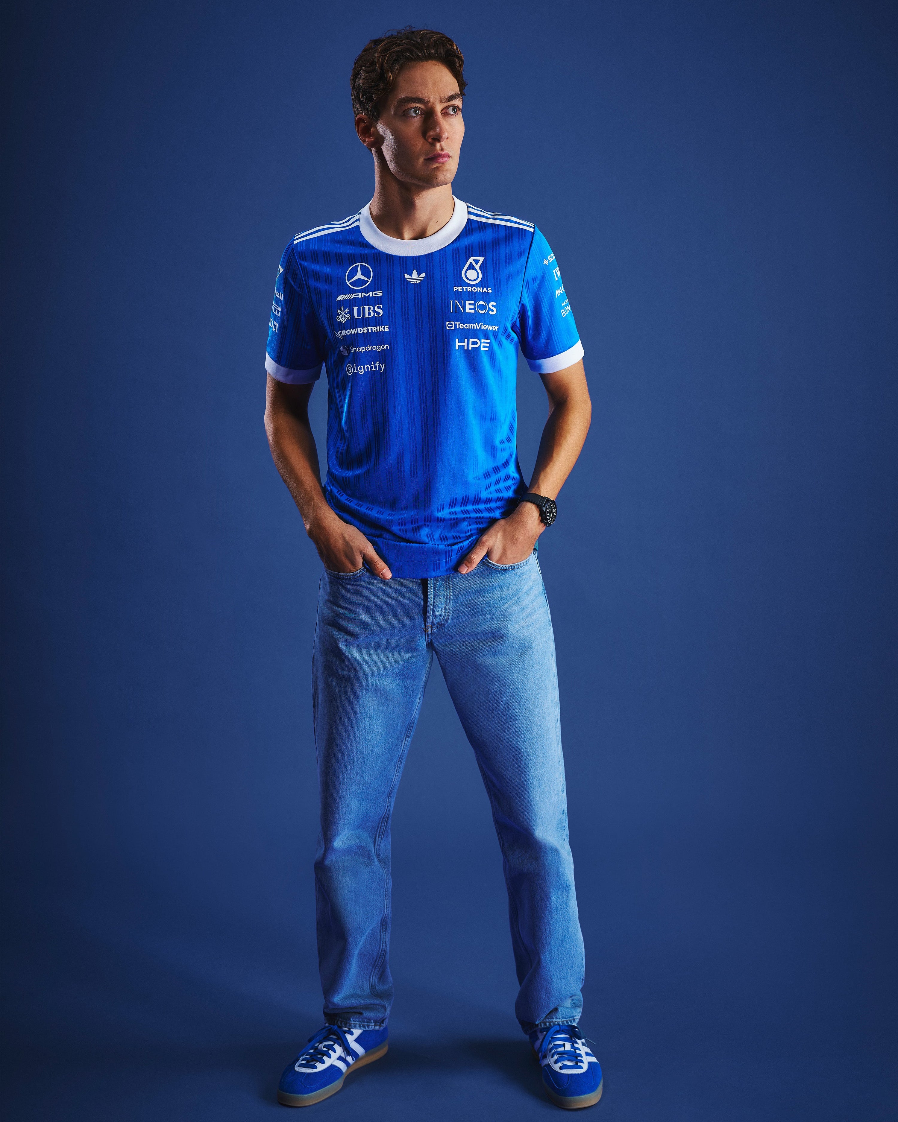 Mens 2026 Blue Wonder Authentic Driver Tee Blue — close-up design detail showing Mercedes-AMG PETRONAS F1 styling and product details | Dash Racegear