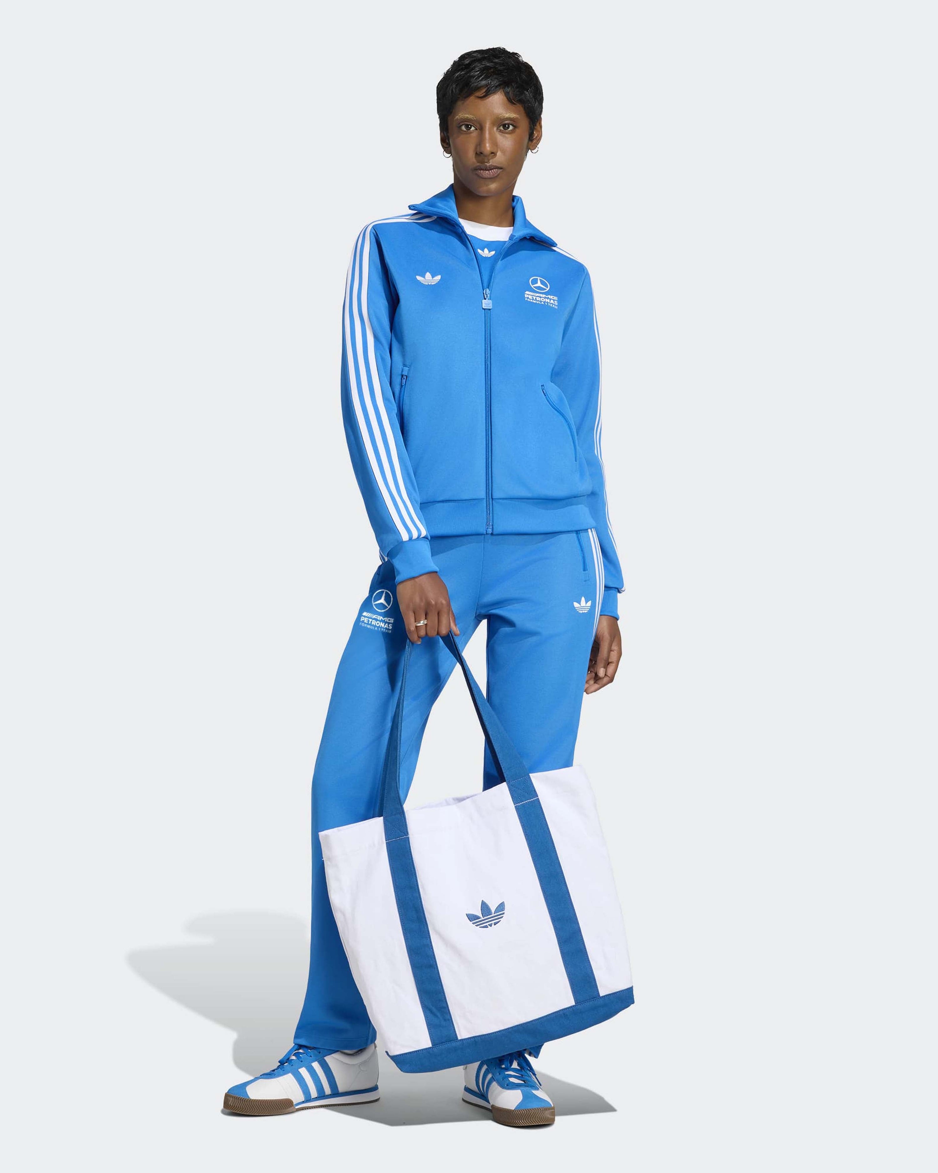 Womens Blue Wonder Track Top Blue — close-up design detail showing Mercedes-AMG PETRONAS F1 styling and product details | Dash Racegear