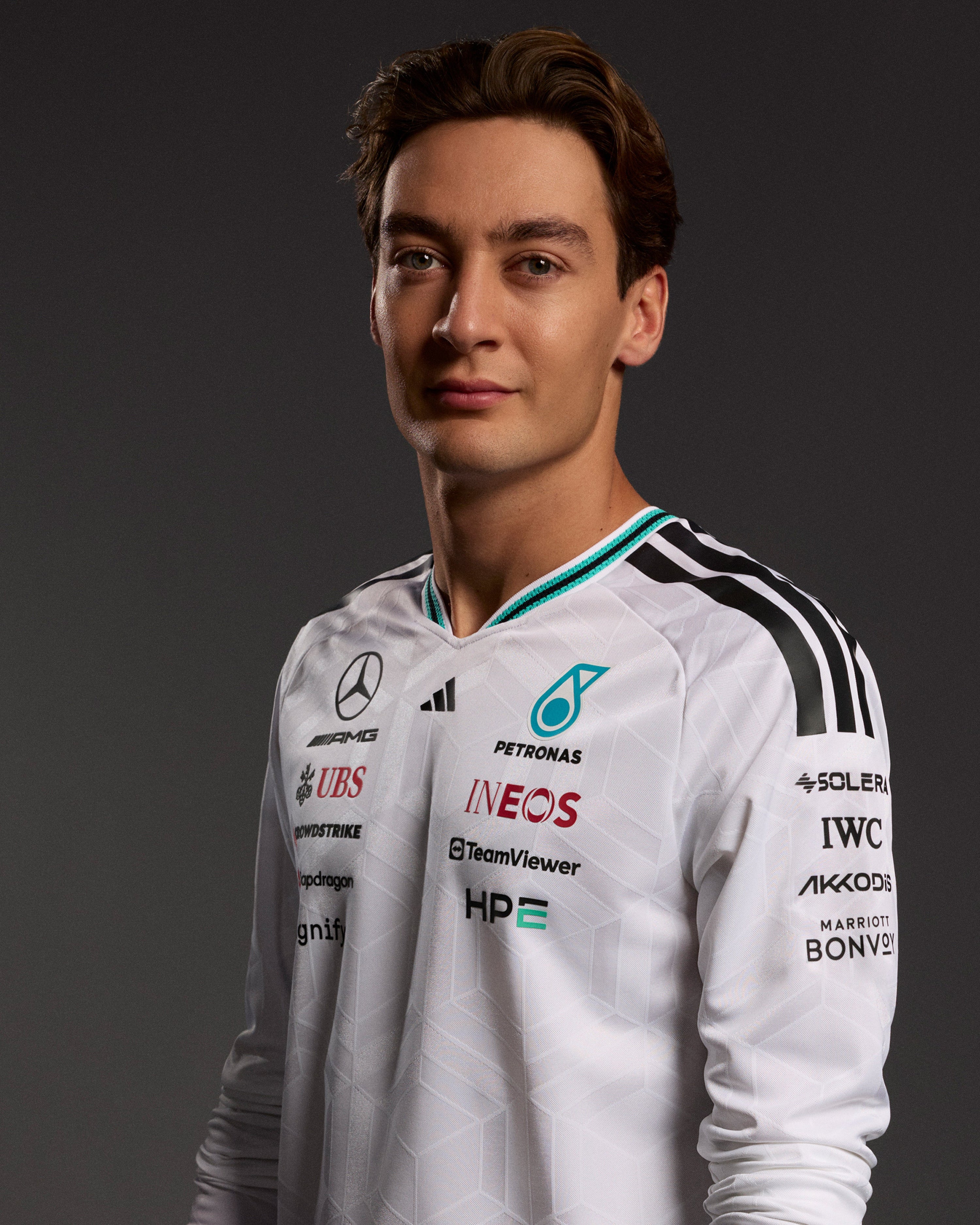 Mens 2026 Authentic Long-Sleeve Driver Tee White — alternate product angle showing Mercedes-AMG PETRONAS F1 styling and product details | Dash Racegear