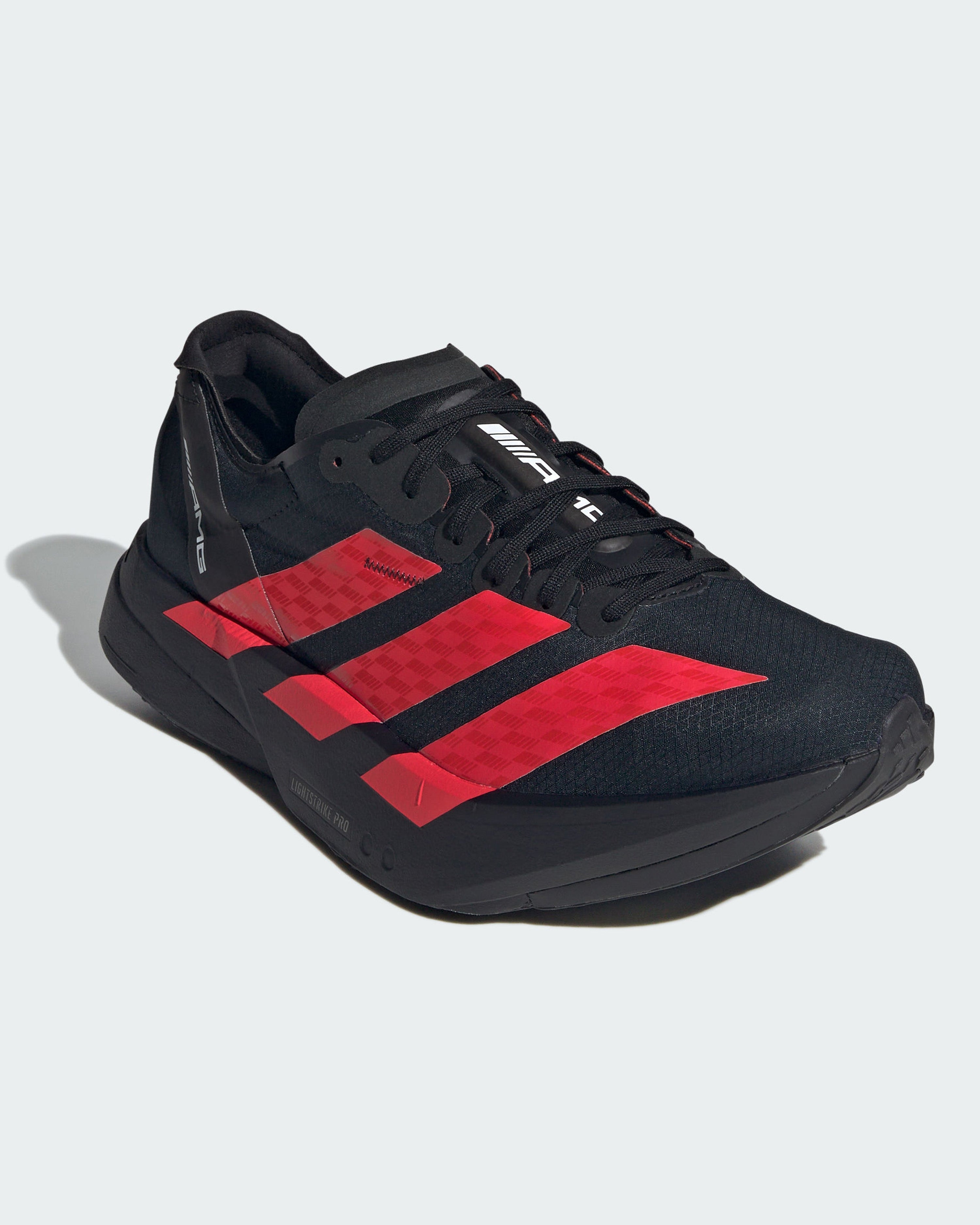 Adizero AMG Adios Pro 4 Shoes Black — close-up design detail showing Mercedes-AMG PETRONAS F1 styling and product details | Dash Racegear