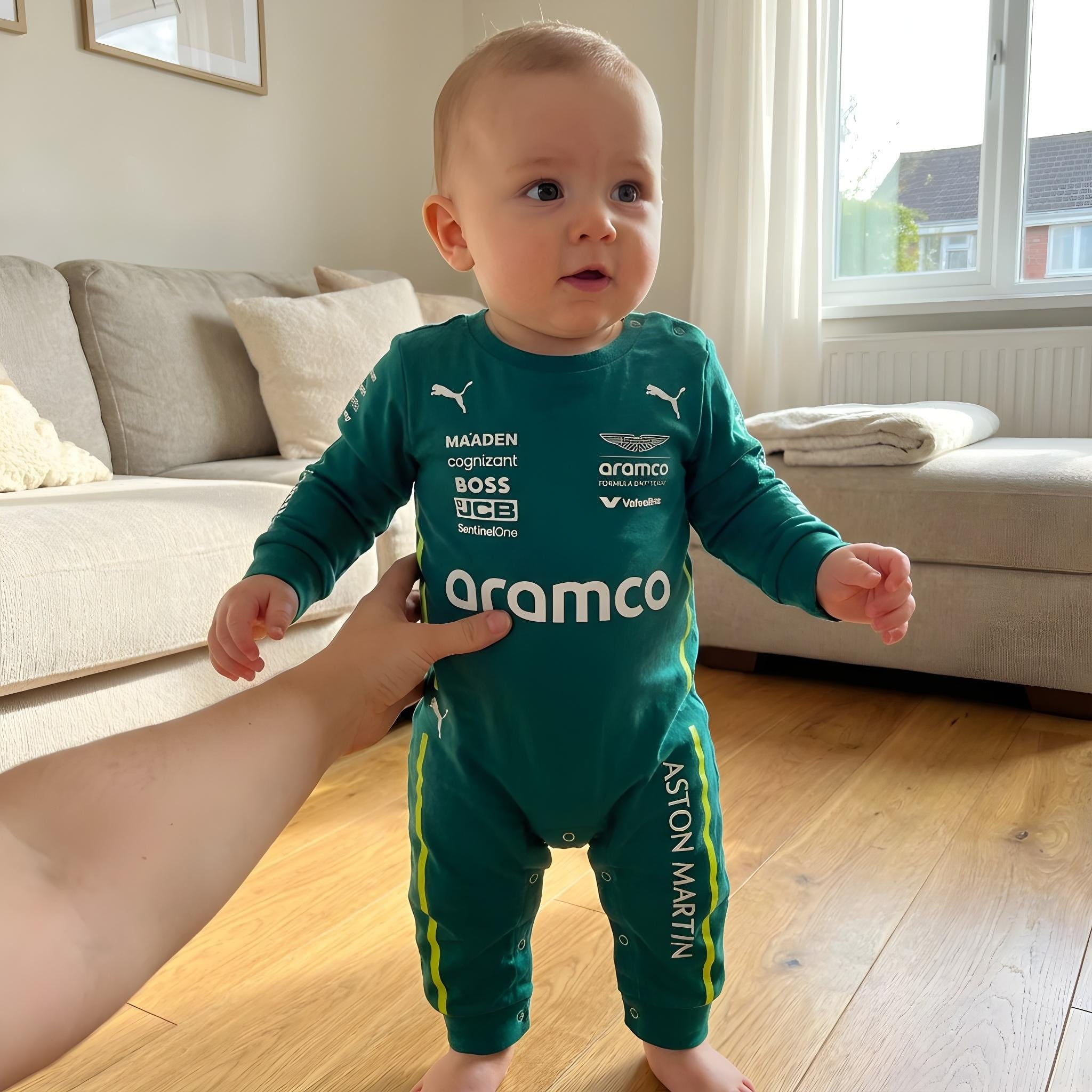 Aston Martin Longsleeve Jumpsuit 2025 - baby wearing aston martin formula one themed onesie with parent | Dash Racegear