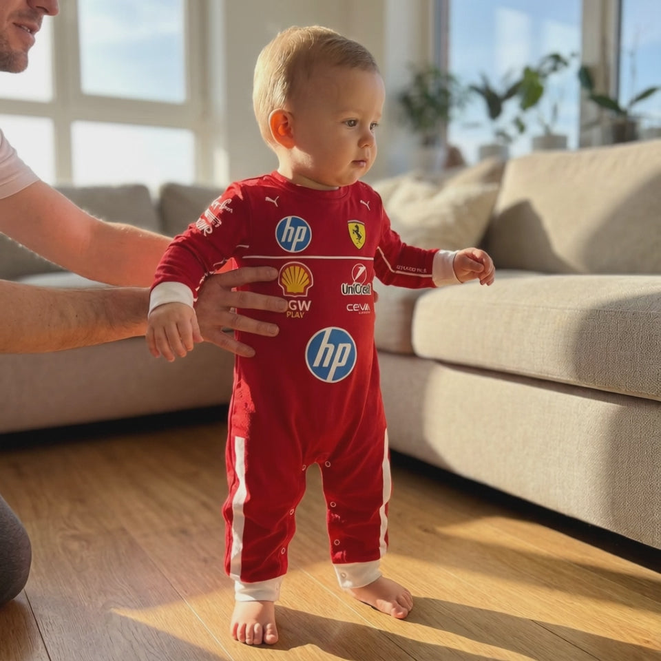 Ferrari inspired Longsleeve Jumpsuit 2025 - video of Cute Baby Taking First Steps Wearing a Scuderia Ferrari Baby Onesie Jumpsuit Side Shot | Dash Racegear