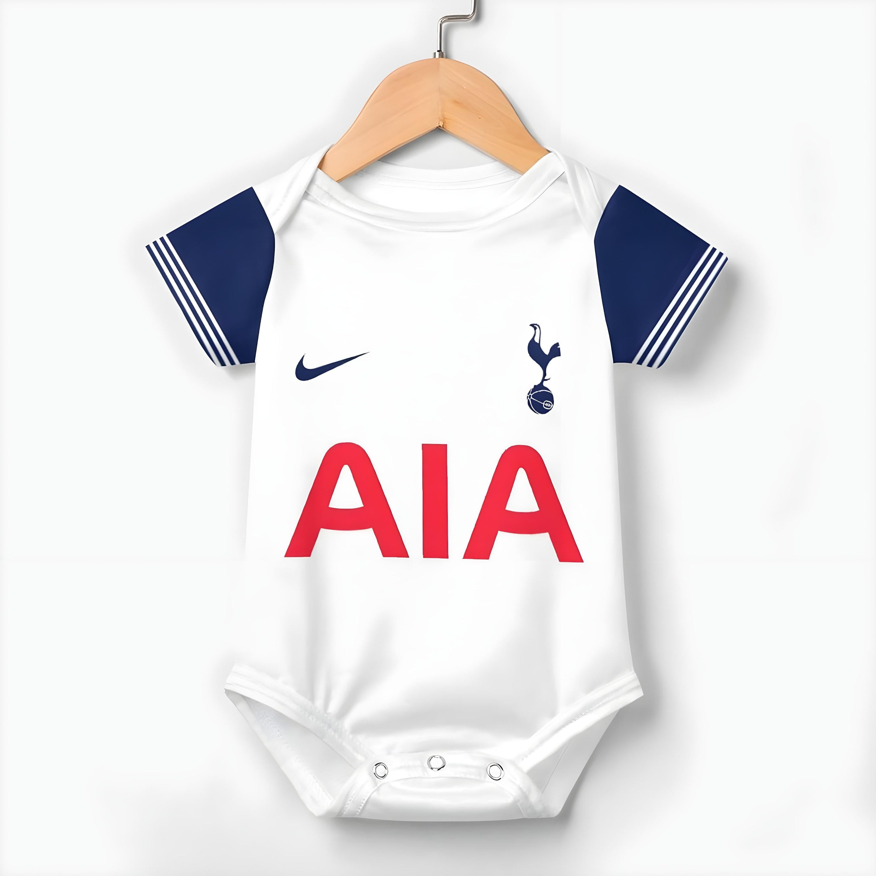 24/25 Tottenham Baby Bodysuit - tottenham spurs baby onesie front hanging on a hanger on white background | Dash Racegear